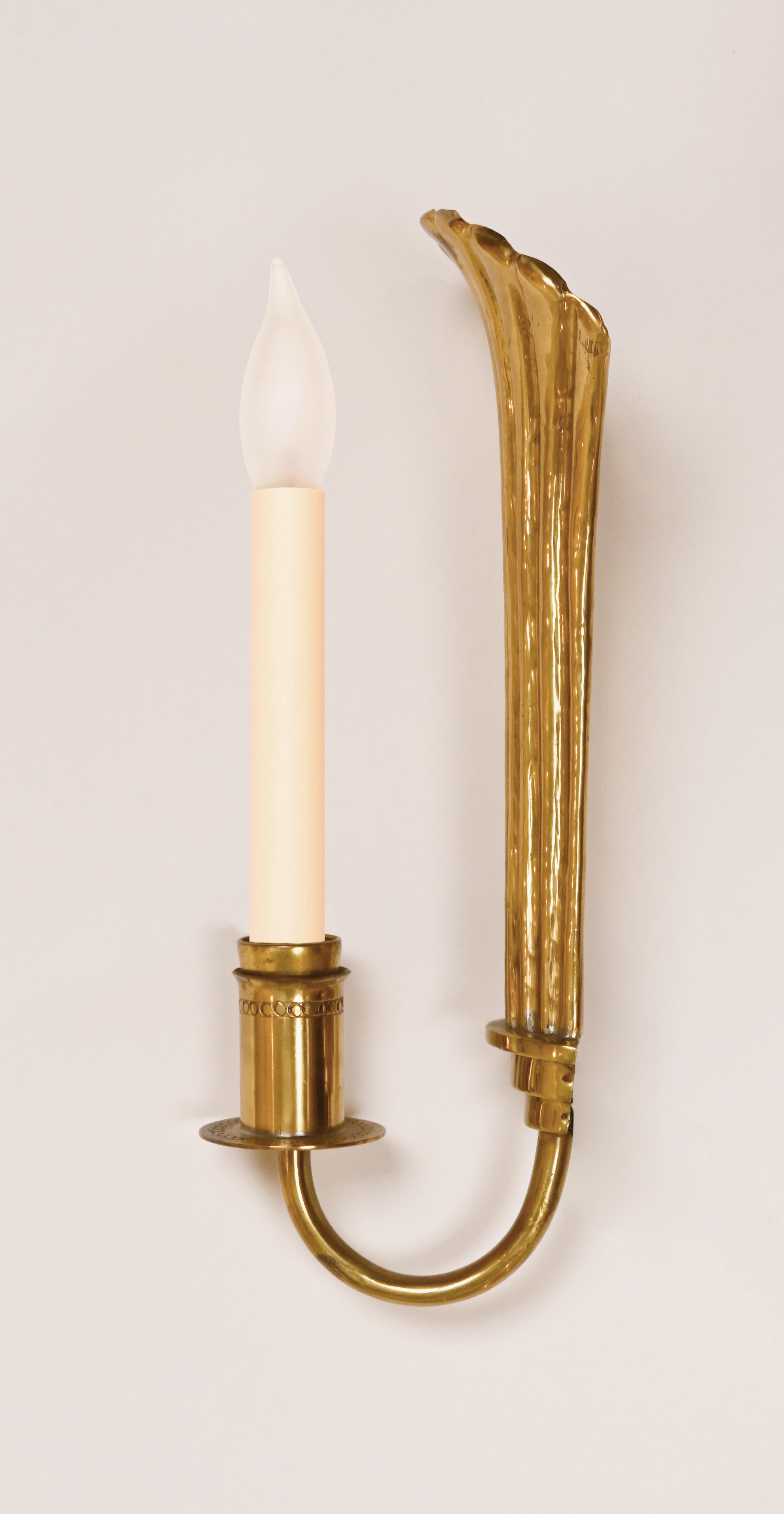 Hand-sculpted wall sconces made by Lars Holmström (1894) company. Label imprinted on the back. Price includes wiring.