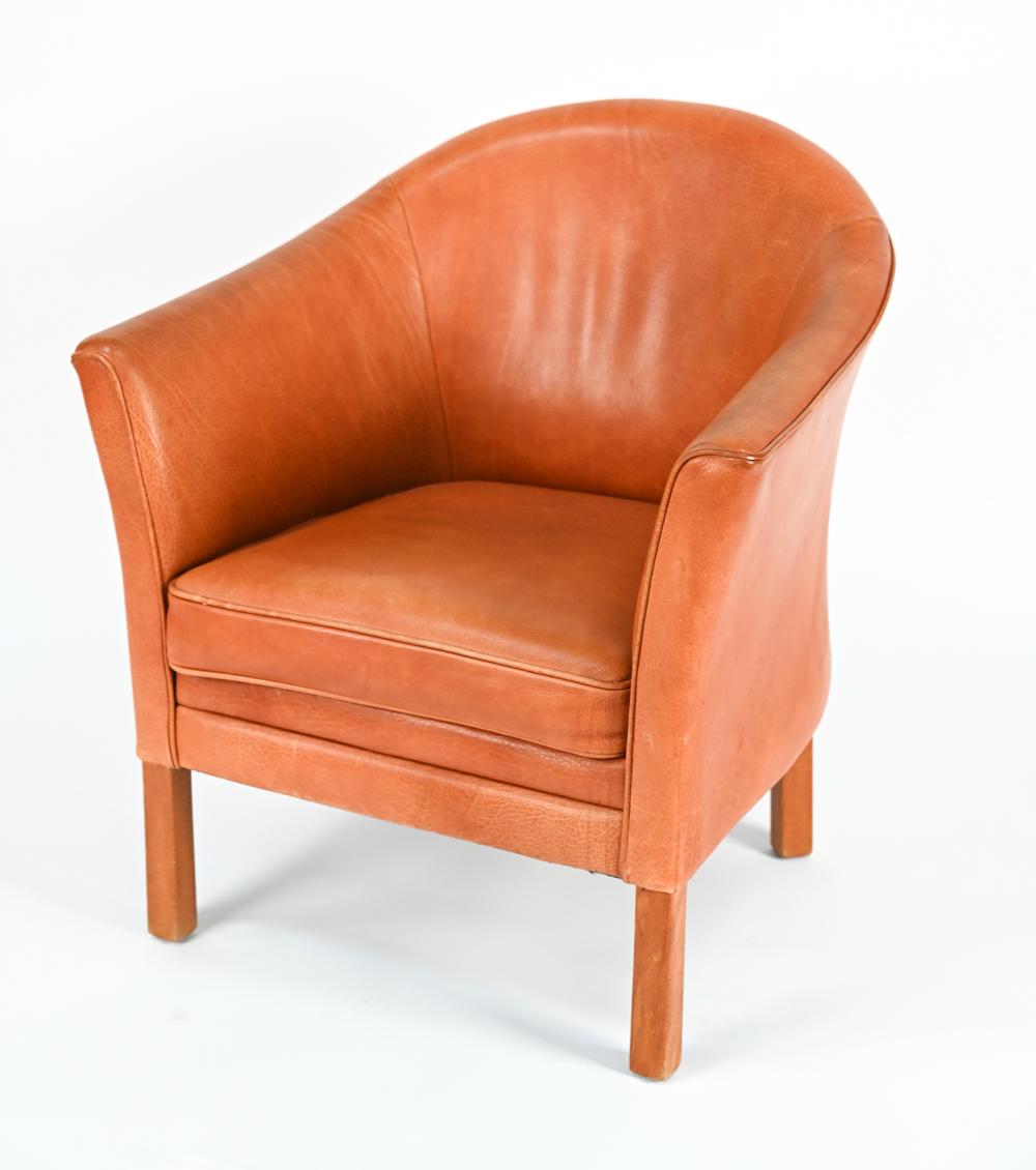 A Danish mid-century easy chair designed by Lars Kalmer for Mogens Hansen, upholstered in butterscotch leather.