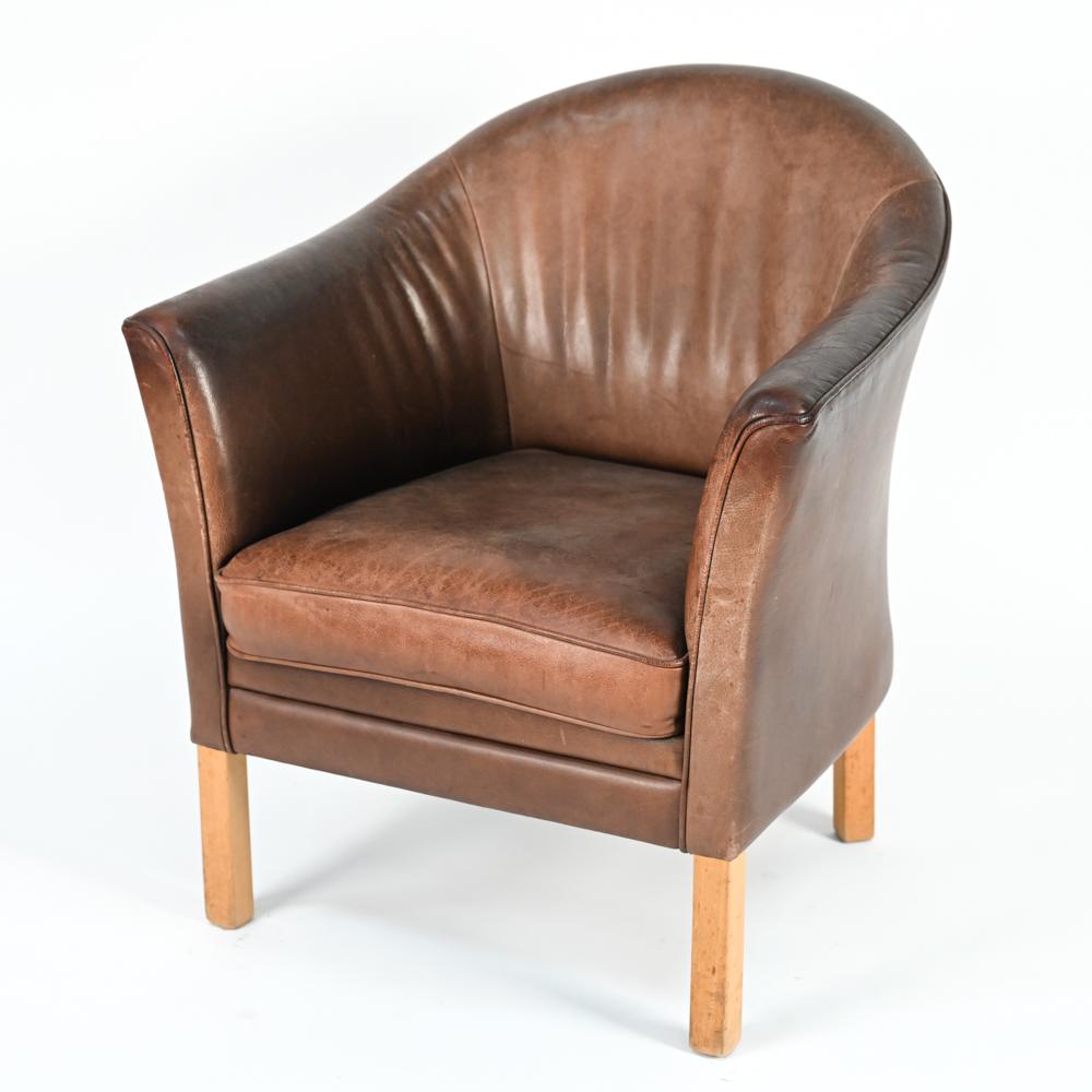 A Danish mid-century easy chair designed by Lars Kalmer for Mogens Hansen, upholstered in handsome leather.