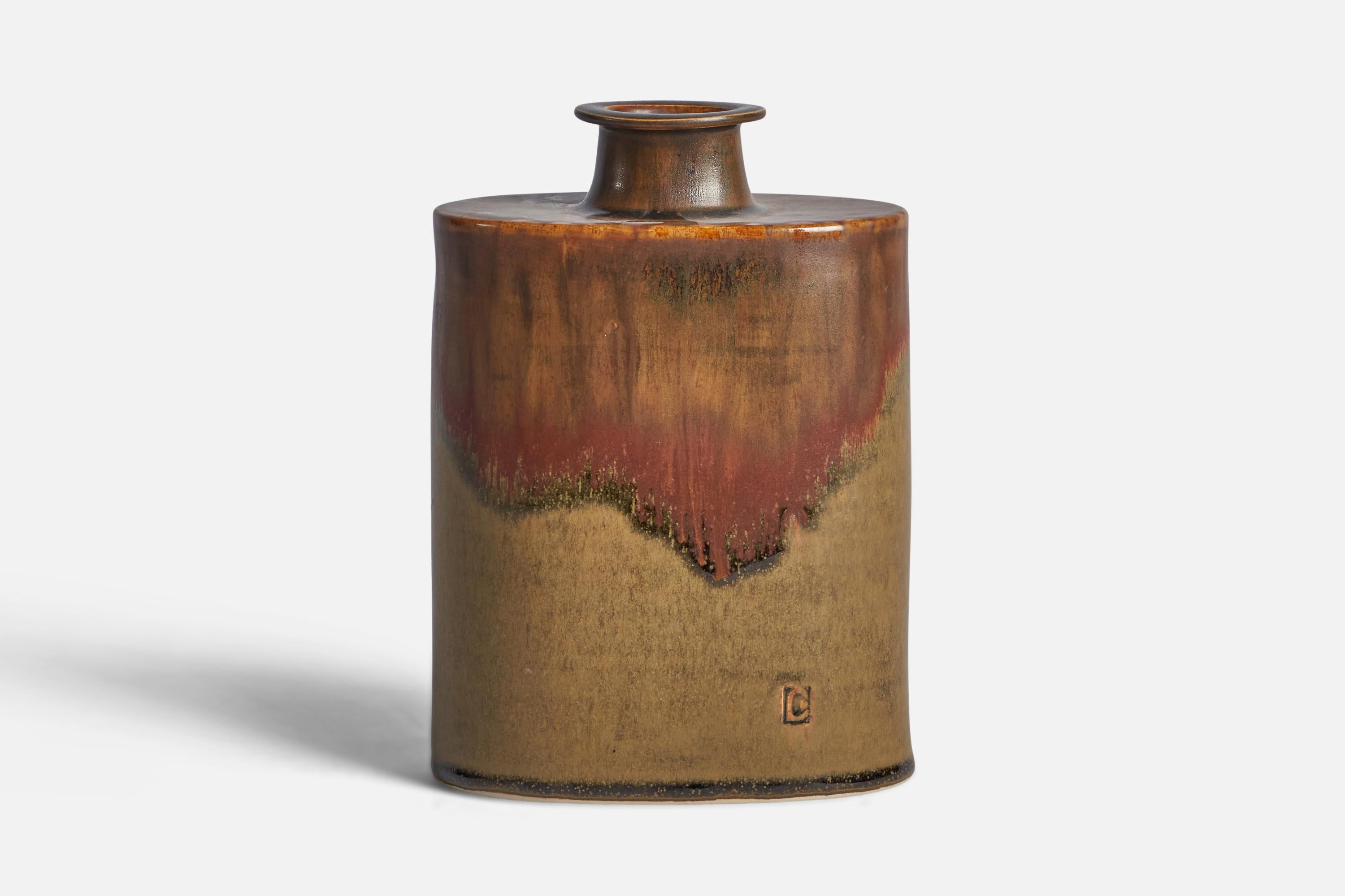 A red and beige-glazed stoneware vase designed and produced by Larsdrejare, Laholm, Sweden, c. 1960s.