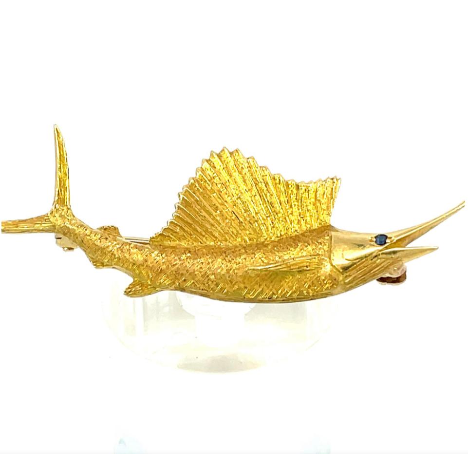 Yellow Gold Swordfish 18K w/ Sapphire Eyes 1950s 

Presenting a stunning vintage 1950s 18k yellow gold swordfish pin, a luxurious statement that epitomizes elegance and sophistication. This exquisite pin is crafted from solid 18k yellow gold, known