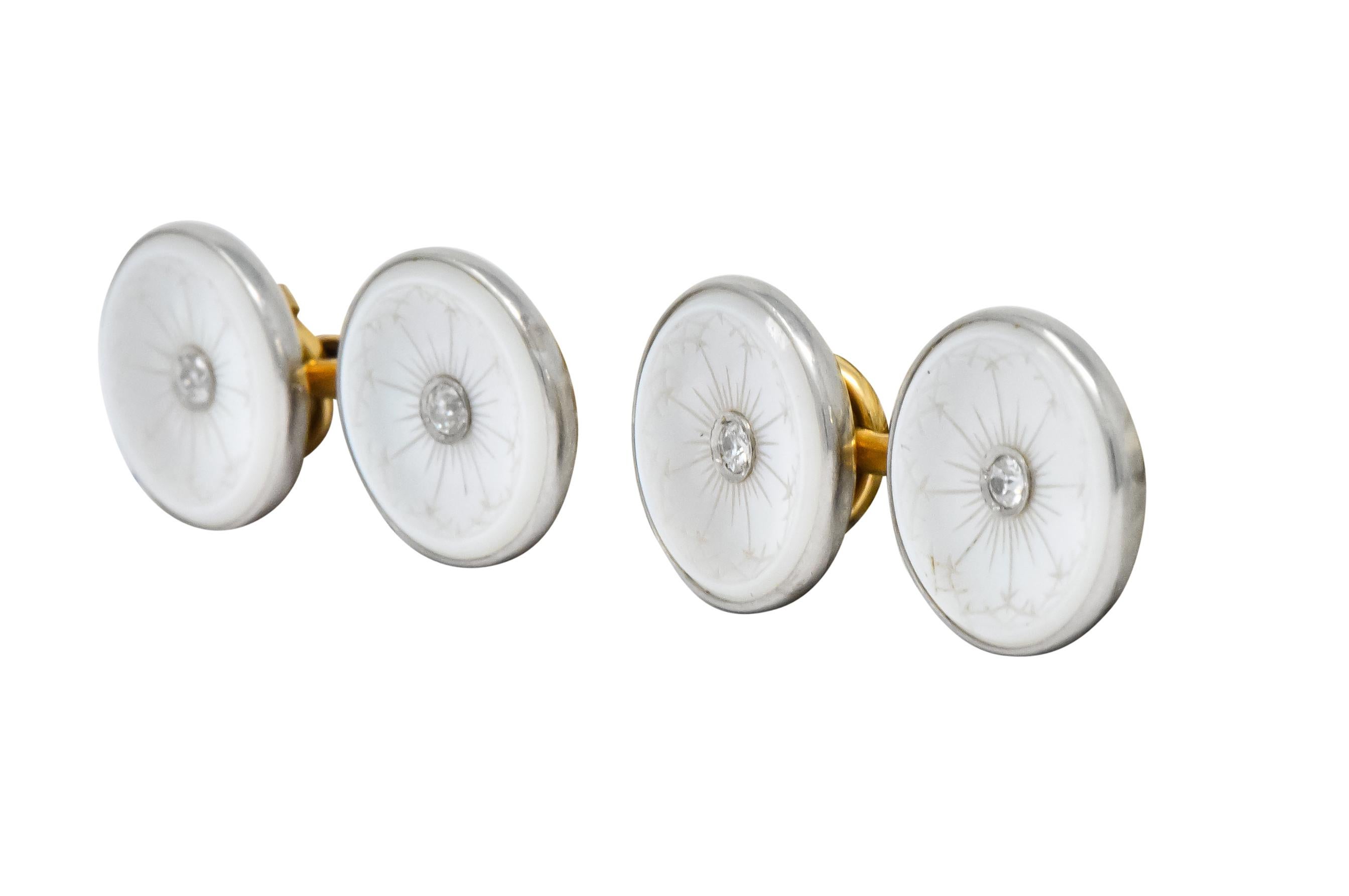 Link style cufflinks, bezel set on both ends, with circular white mother of pearl measuring 1/2 x 1/2 inch

Each mother of pearl disk is engraved with a linear design while centering a round brilliant cut diamond, eye-clean and white

With maker's