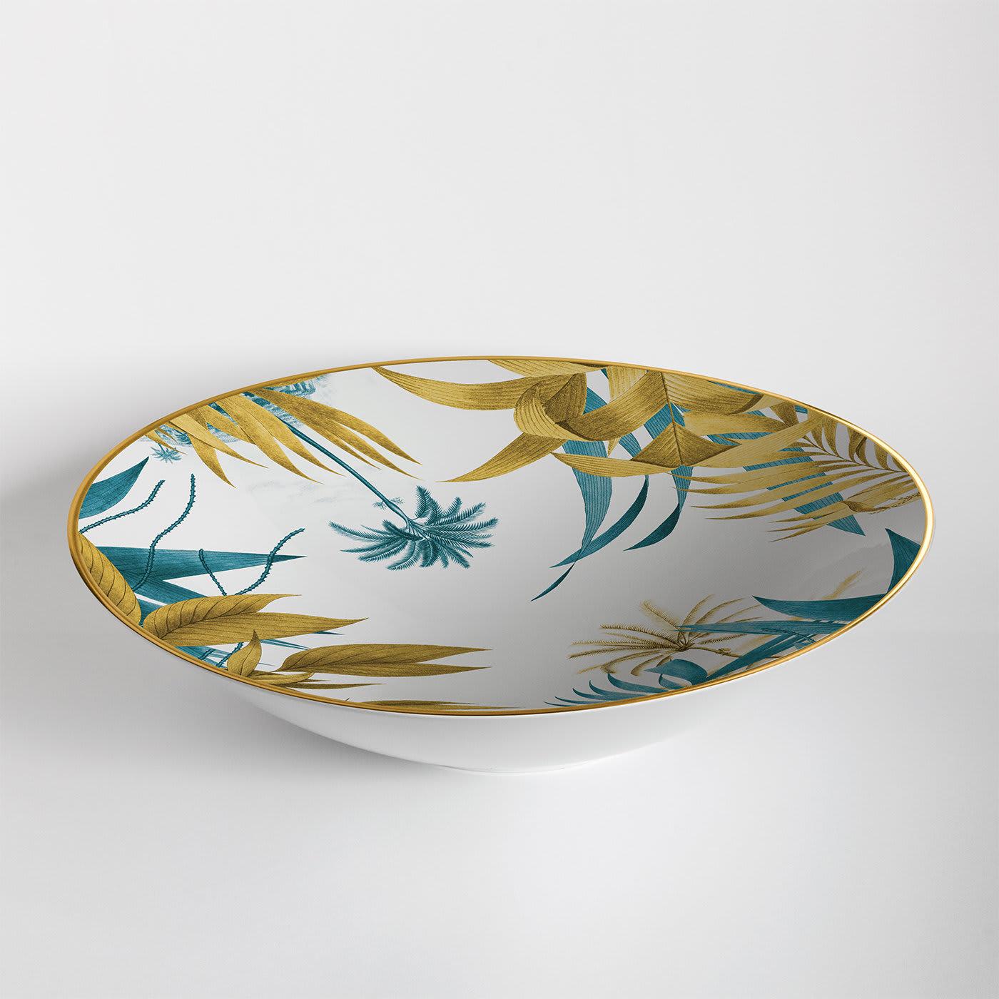 Set on a refined dining room table as a centerpiece or used as a fruit serving plate, this elegant bowl will make a singular addition to any traditional or modern decor. Handmade of white porcelain, it features a delicate yet captivating image of a