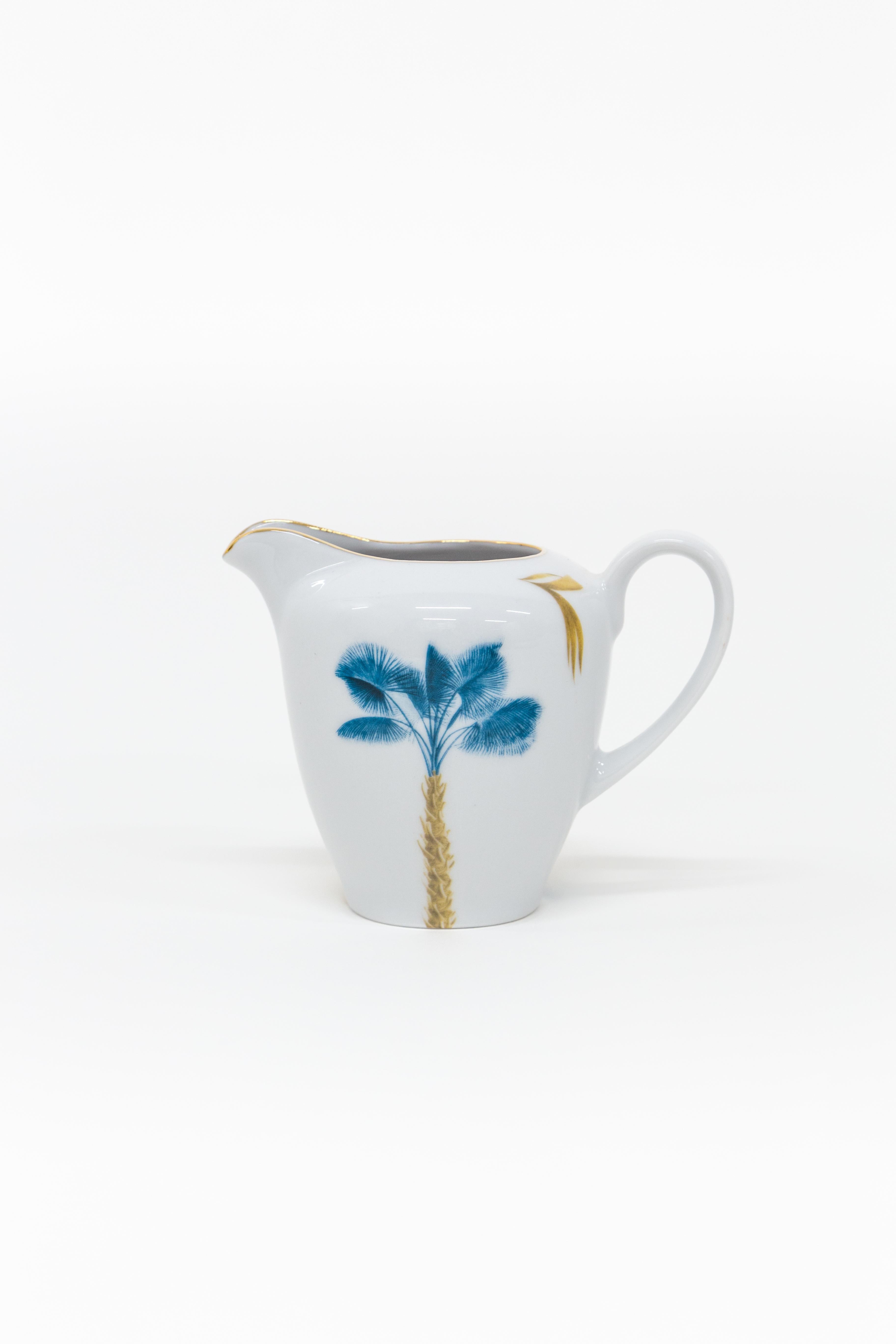 This Tea Time Set is part of the Las Palmas Porcelain collection by Grand Tour by Vito Nesta, inspired by Vito's extensive travels around the world. In this set, beautiful palm trees are surrounded by golden and blue leafs. This design is a dainty