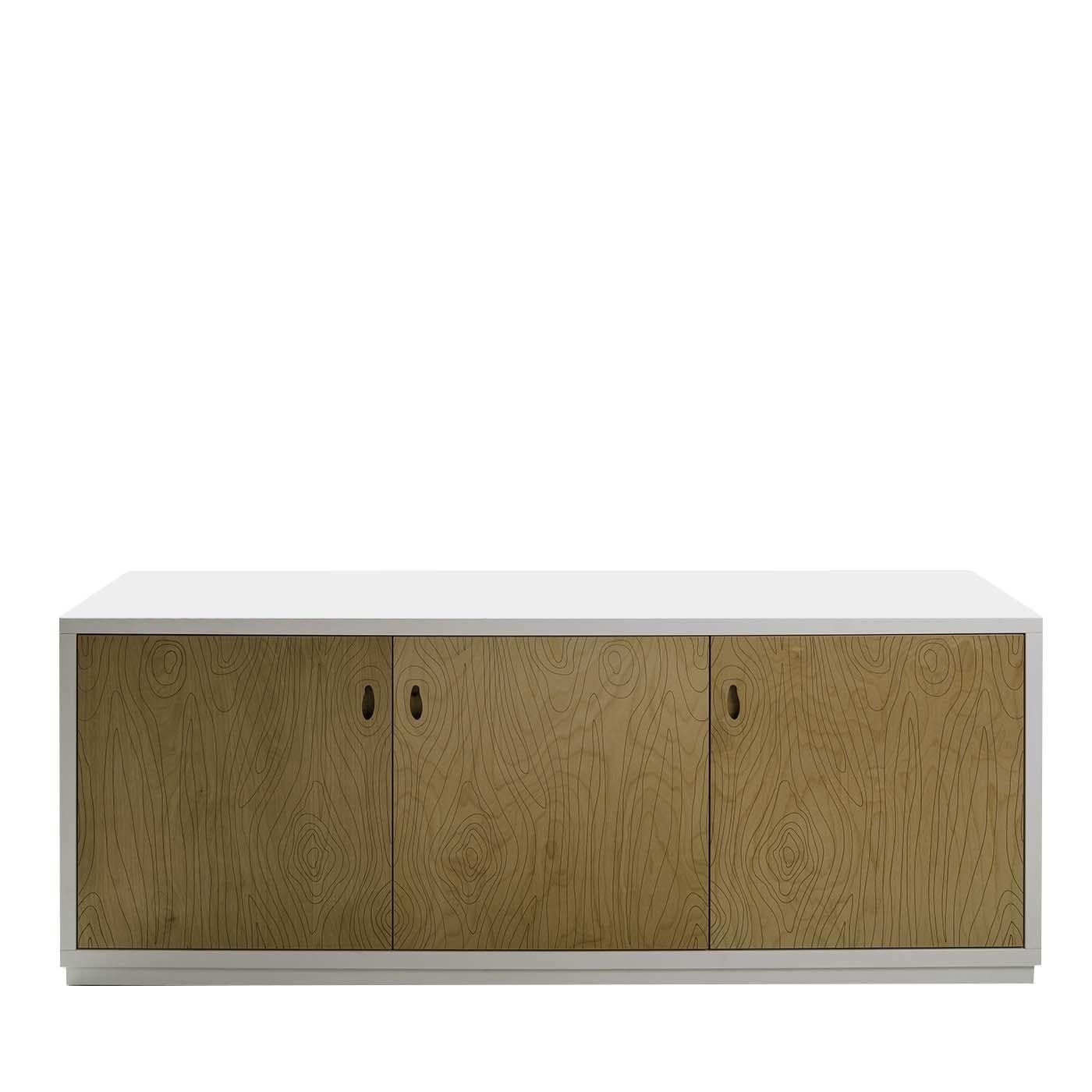 Linear and sophisticated, this modern sideboard is made of birch with a structure treated with white texturized lacquer both inside and out. The interior features three separate compartments individually divided by shelves to create a versatile