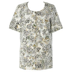 Veste d'été en coton blanc découpé au laser et orné de fleurs Chanel