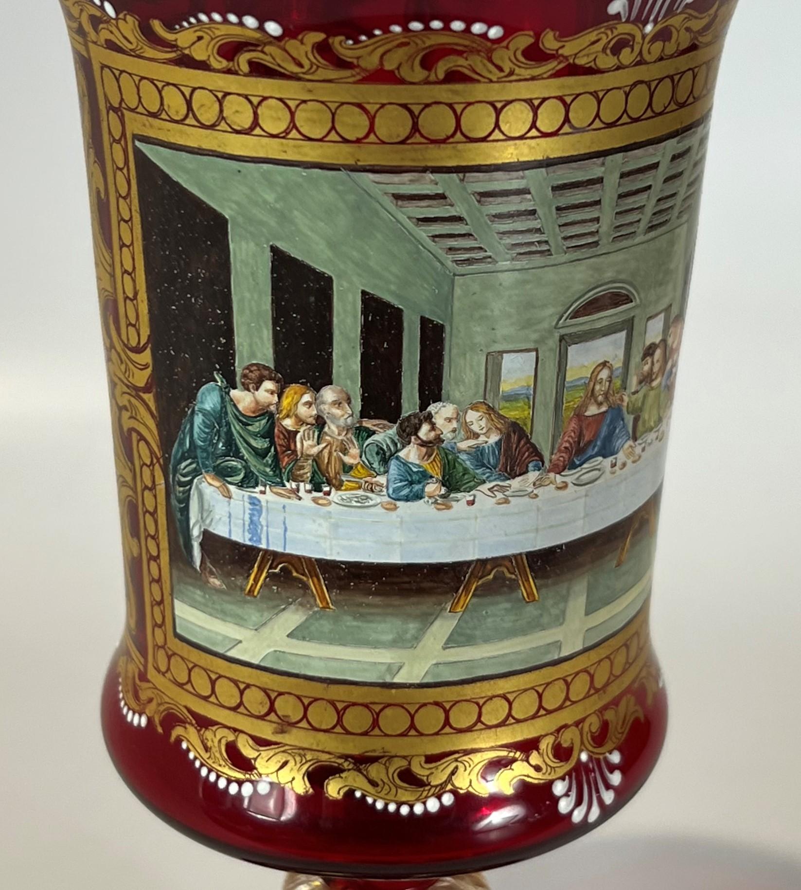 The Last Supper by Leonardo Da Vinci on a Murano ruby red blown glass with aventurine stem goblet. The quality of the Renaissance style painted enamel and depth of surface is extraordinary and well represented in the photos. The Neoclassical and