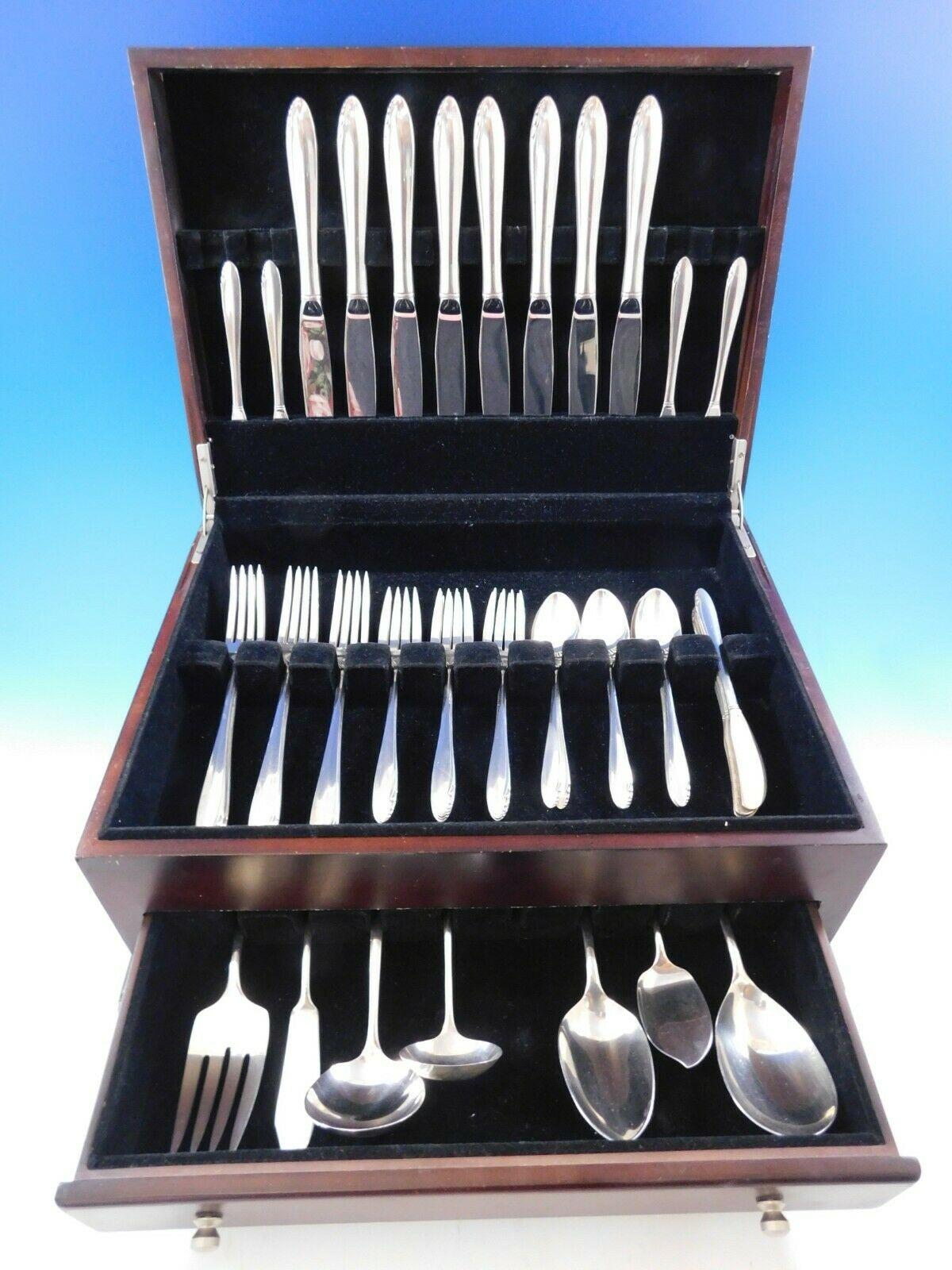 Scarce dinner size lasting spring by Oneida sterling silver flatware set, 46 pieces. This pattern has a timeless, Mid-Century Modern design. This set includes:

8 dinner size knives, 9 5/8