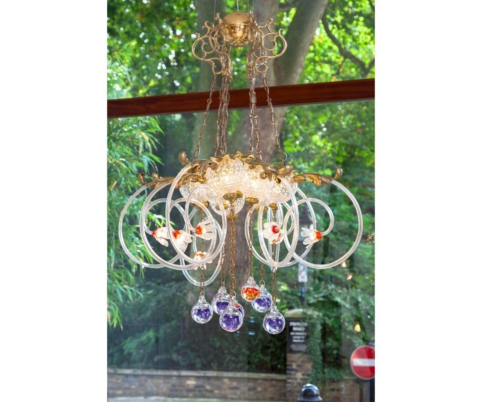 The small Big Bang. History has encountered a new era which has exploded into this extraordinary chandelier. Seemingly disparate decorative components are connected into a playful assemblage of forms, materials and stories. Galaxy Luminia is like a