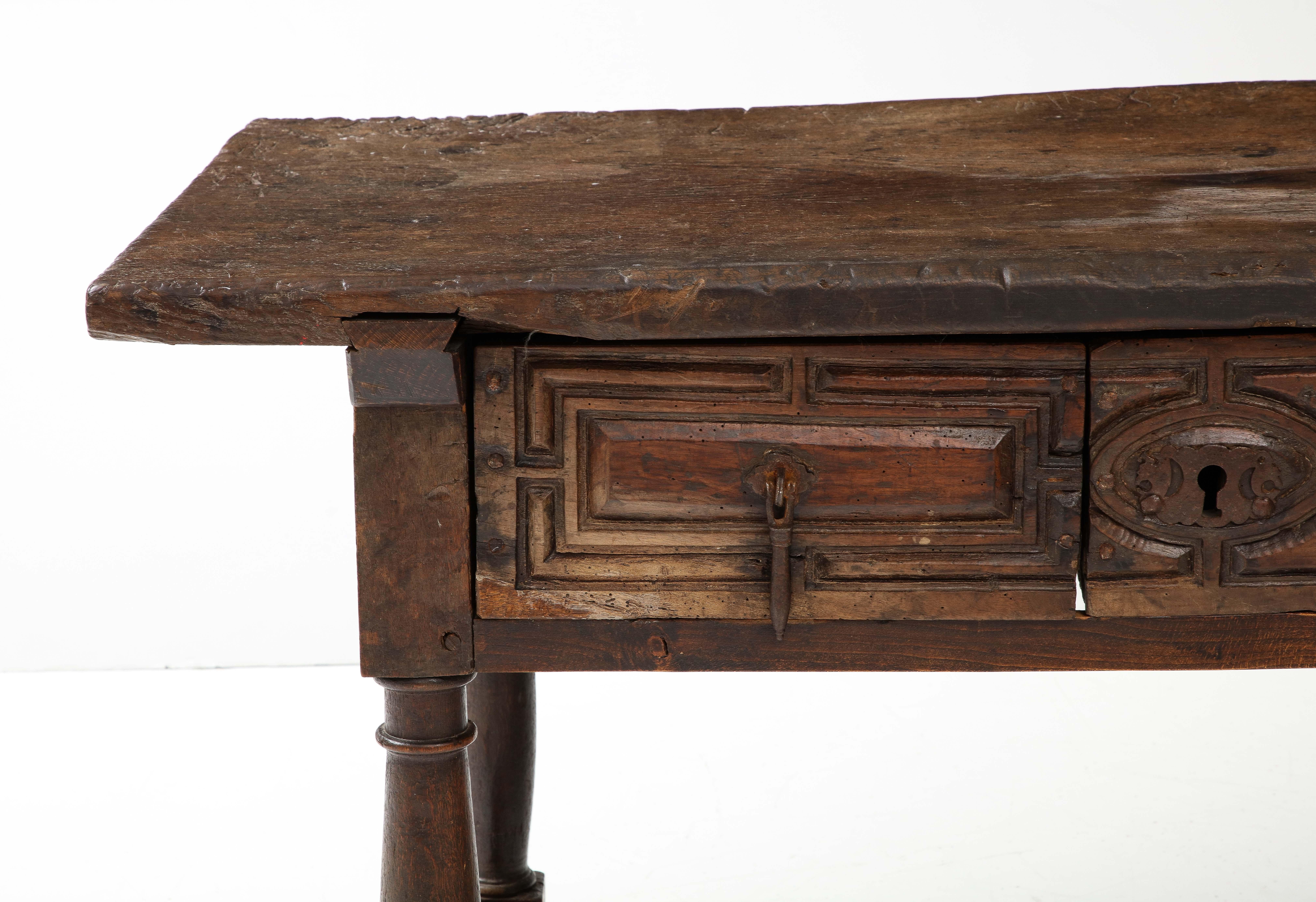 Late 16th C. Spanish Walnut Table with Iron Pulls
Walnut, iron

H: 32 D: 29.5 W: 55.5 in.

Incredible Iron pools & Hand Carved Drawers