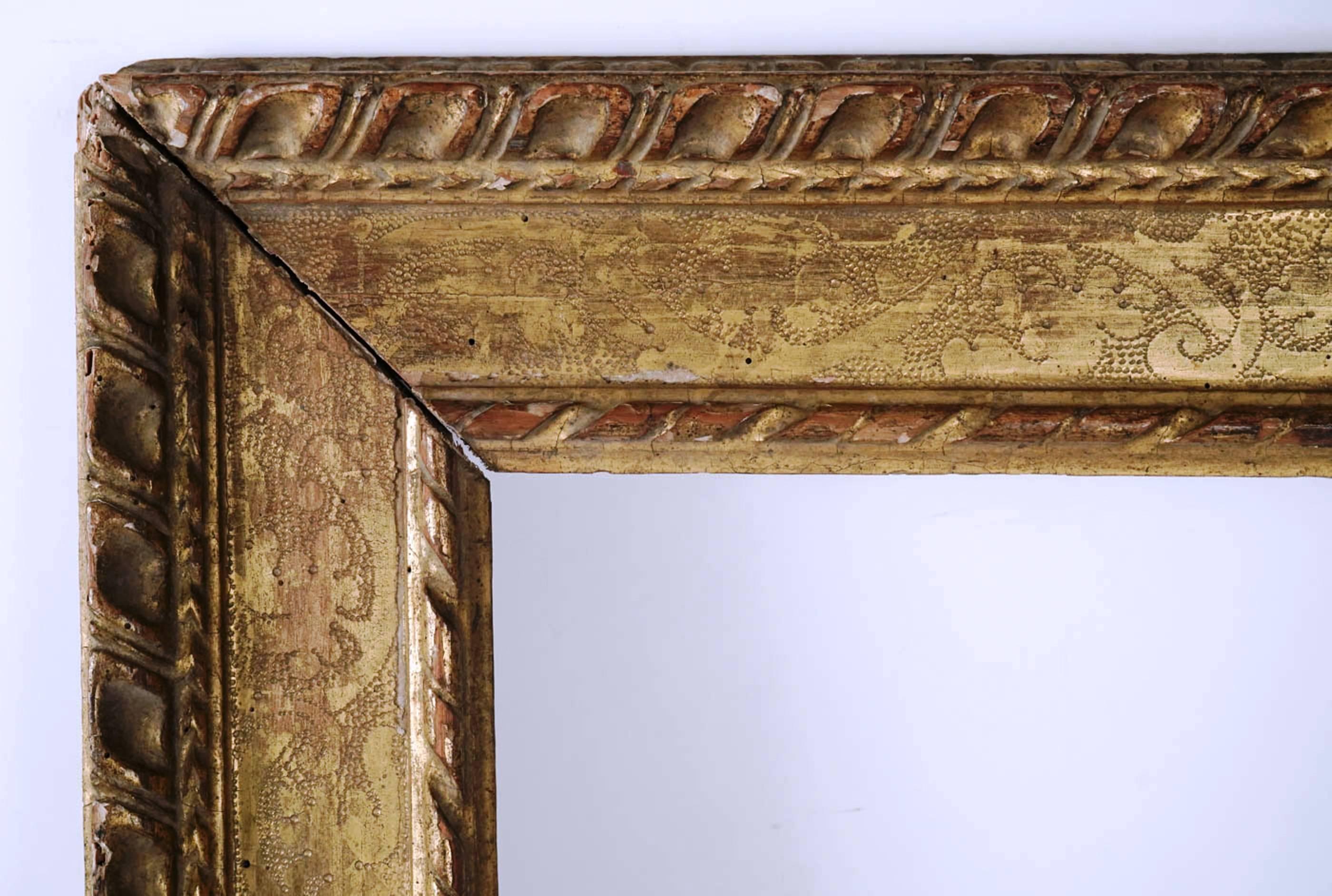 Extraordinary late 16th century frame mounted as mirror, carved giltwood, Italy, 1560s.
Carved giltwood with Bulinatto... mounted as mirror.
It has been recut in the past...
Sight size is:
59 cm x 45 cm
Overall size is
84 cm x 70 cm.
 