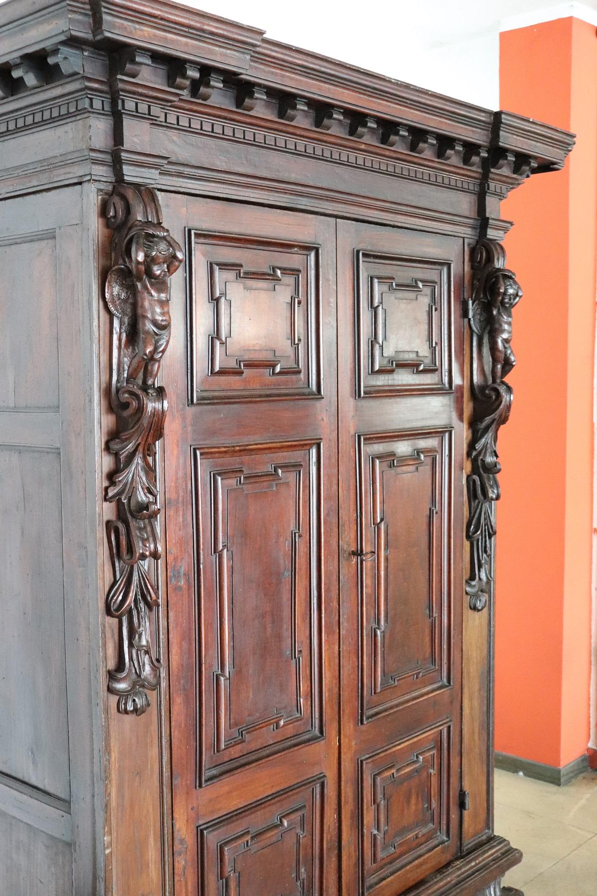 Late 16th Century Italian Louis XIV Hand Carved Walnut Wardrobe or Armoire In Good Condition In Casale Monferrato, IT