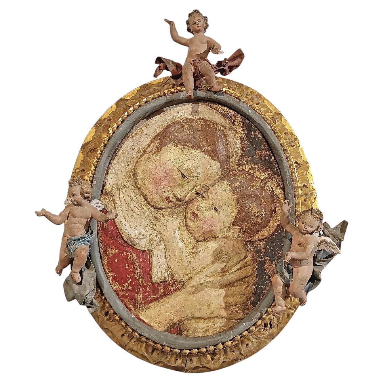 LATE 16th CENTURY POLYCHROME STUCCO WITH MADONNA AND CHILD