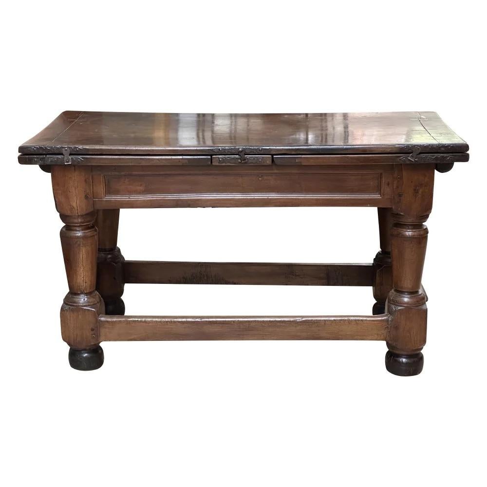 Exceptional  late 16th - early 17th Century French  Walnut Drawleaf or refectory table, Henry II, extending table having a beautiful patina, hand-wrought hardware.  Originally a dining table, also a fine library or center table.  33” h. x 58.5” w.