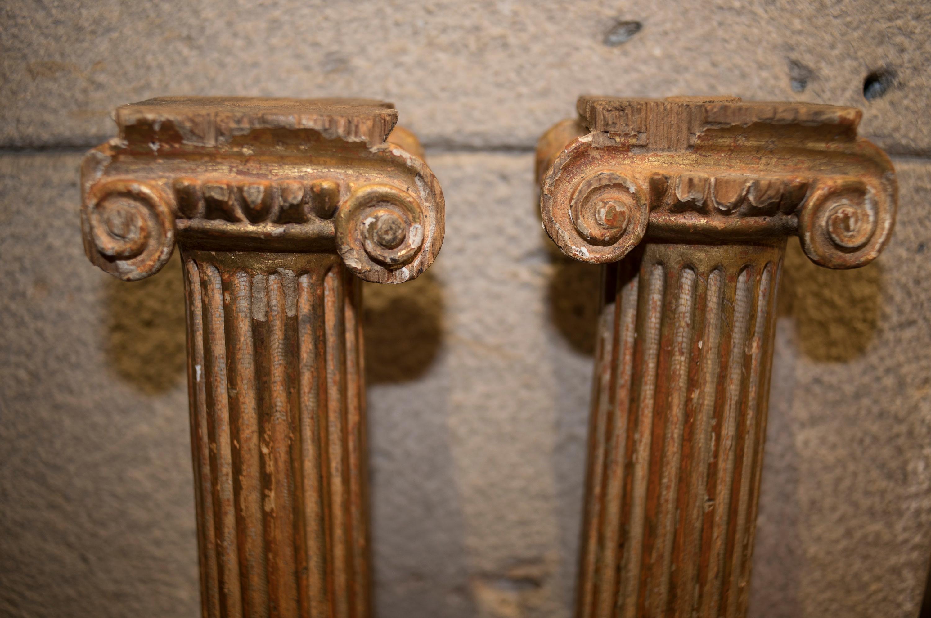 One of a kind couple of Ionic whole columns with scrolls in the capital and basement, in very good condition to age and use. They are made of carved and gilded wood. Grooved shaft.
They comes from an in heritage in southern Italy, in a private