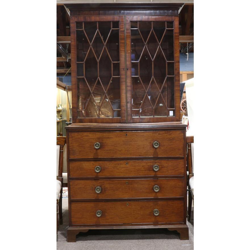  Late 1700's English George III Mahogany Secretary / Bookcase w/ Pull Out Desk with an overhanging cornice above a pair of doors dissected with mahogany lattice panels infilled with individually glazed sections - original glazing still intact. The