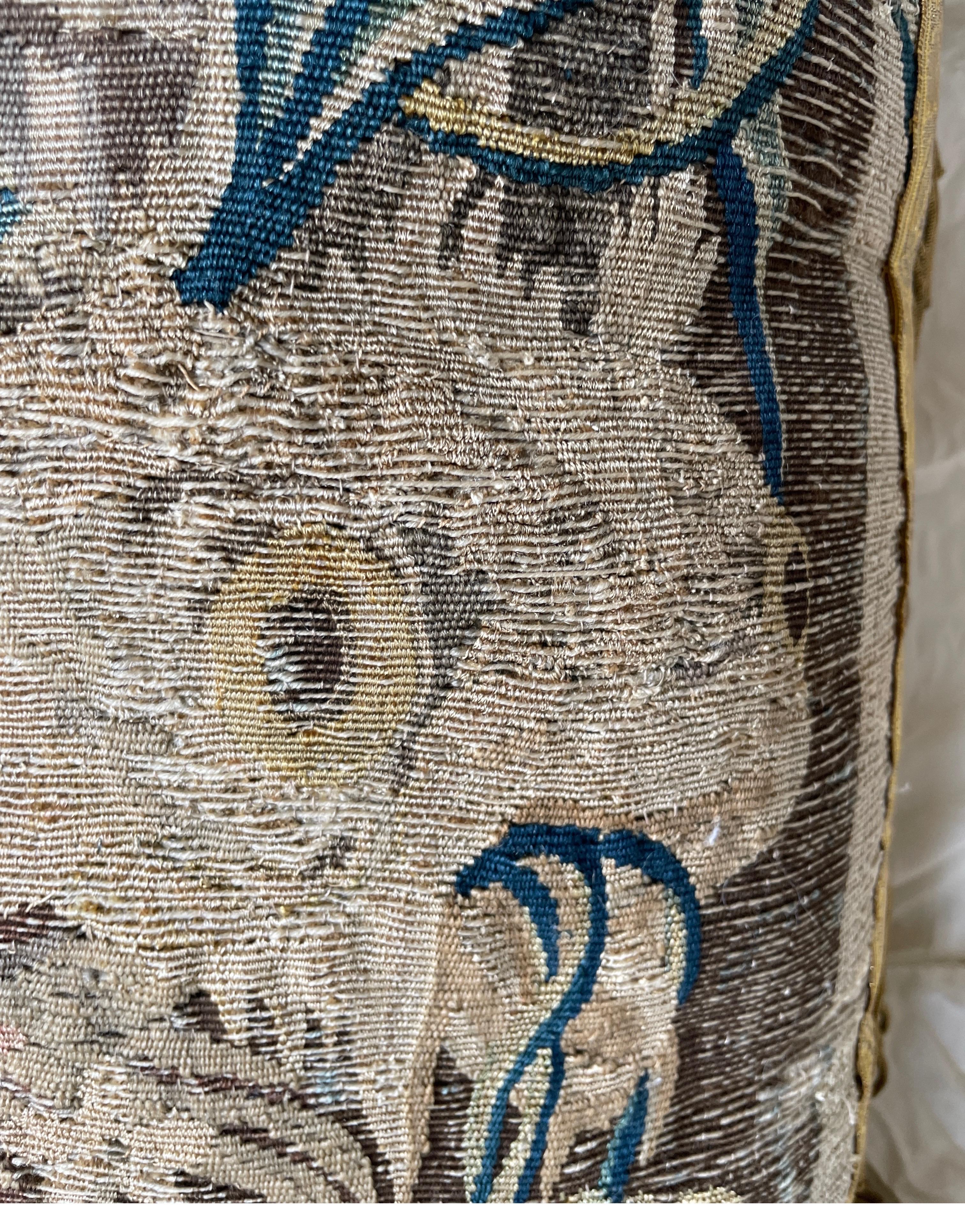 Wool Late 17th C tapestry fragment now as a pillow with silk metal thread border  For Sale