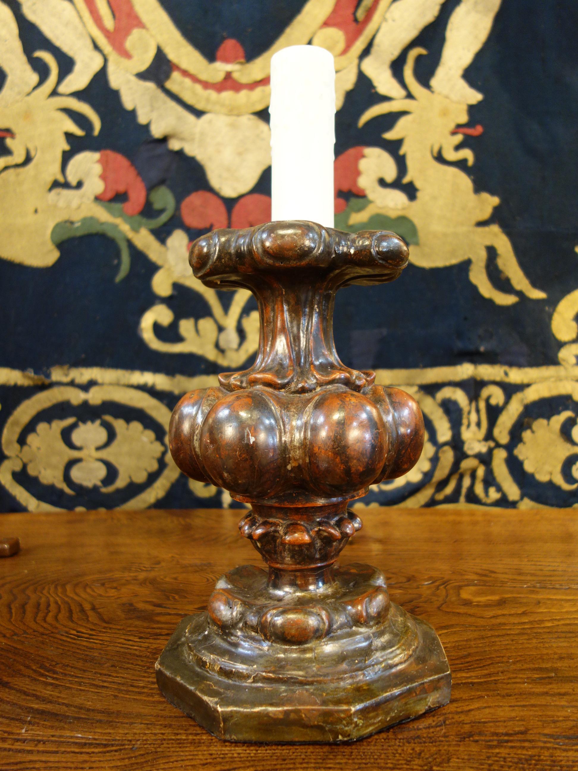 Late 17th century Baroque period, beautifully patinated pair of wood candelabra. Deep red hues created with bolo and silver leaf handcraft technique on plaster. Dramatic ovule gem shapes. Professionally UL re-wired for candelabra base bulbs, ready