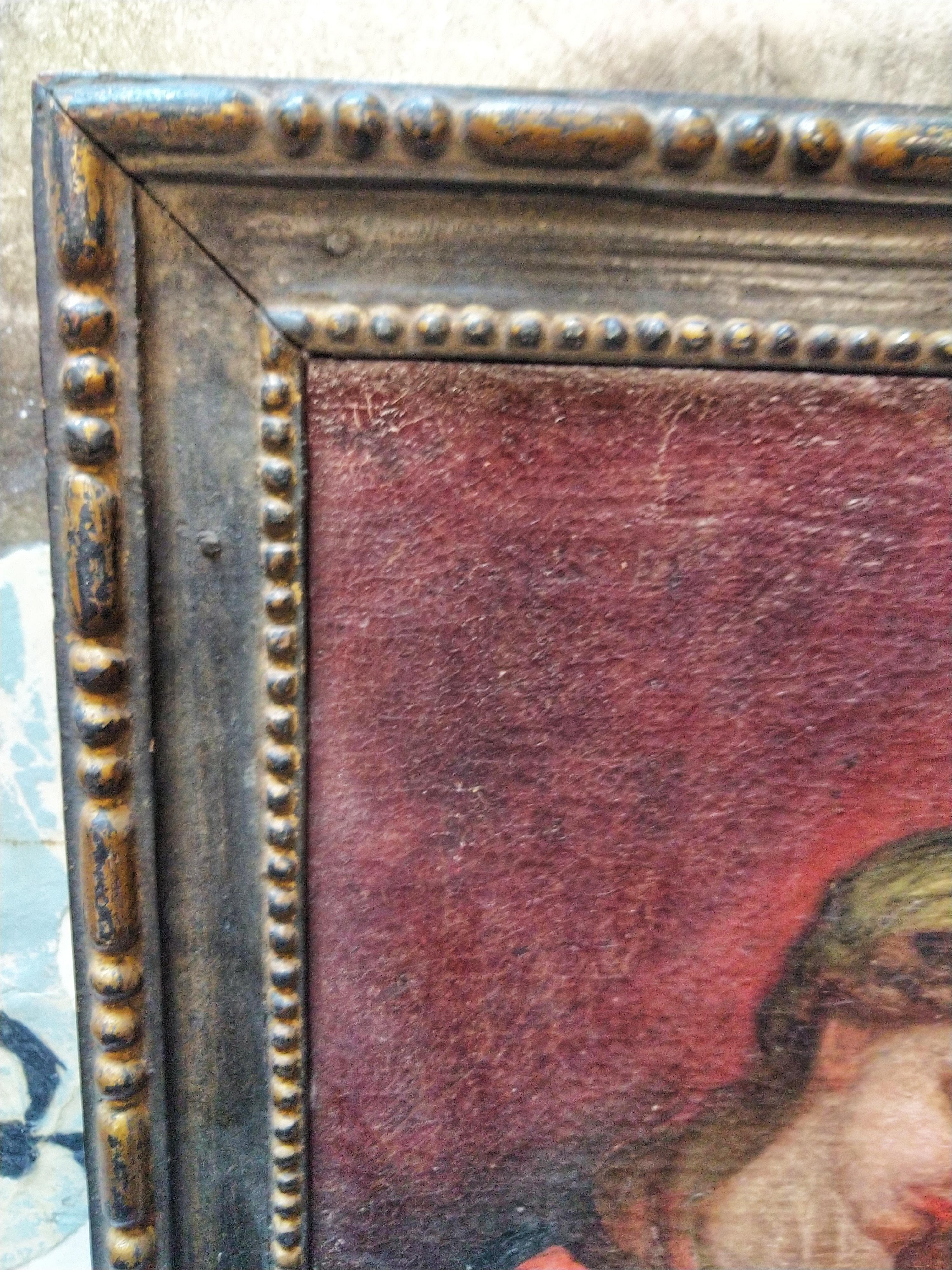 Beautiful oil on canvas depicting the virgin with the infant Jesus. Coeval wooden frame.