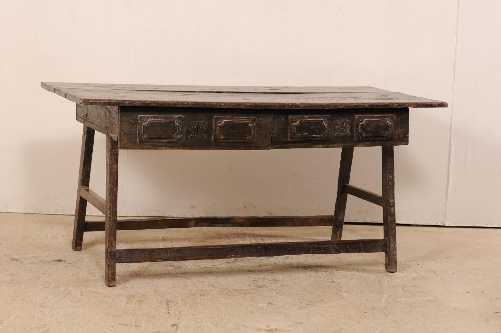 A wonderfully rustic Brazilian two-drawer console table from the late 17th-early 18th century. This antique table from Brazil is constructed of peroba wood, which is a tropical native hardwood, 35% harder than oak. The table has a rectangular-shaped