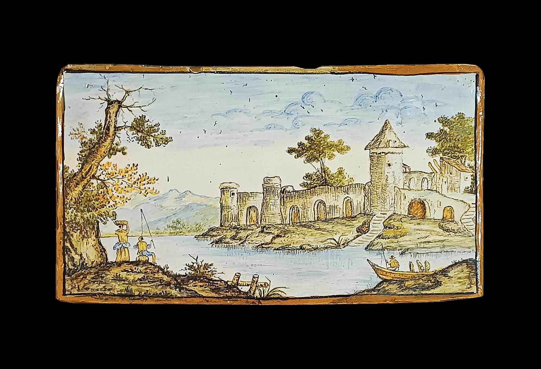 Splendid polychrome majolica plaque, attributable to the renowned Castelli factory, located in Abruzzo (Central Italy), and dating back to around the end of the 17th century. The plaque depicts a river landscape, with a castle in the background and