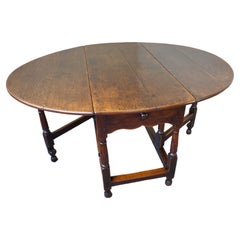 Late 17th Century English Oak Gateleg Dining Table.