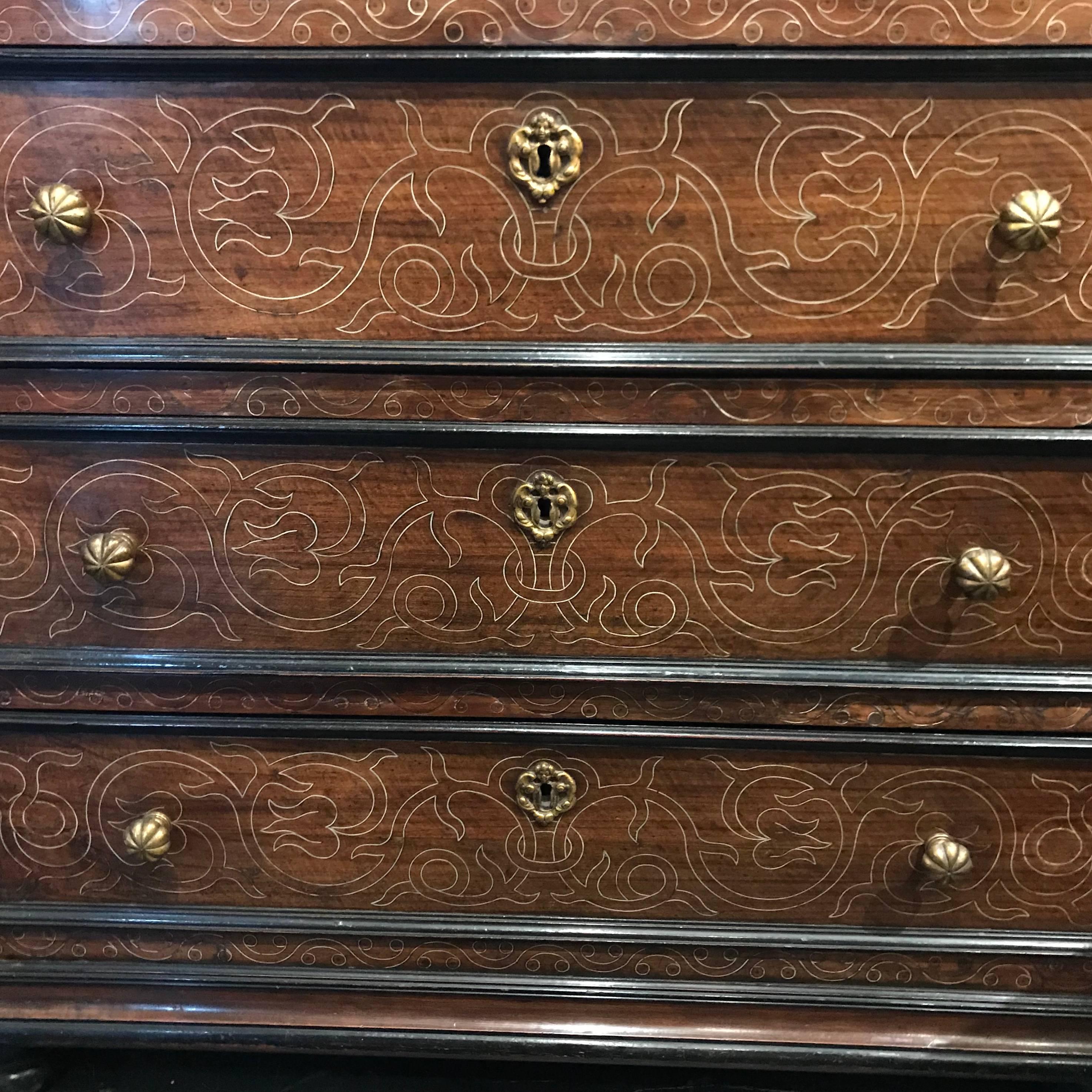 Late 17th century Italian three drawer commode with very decorative gold gilt engraved front drawers.
Bronze pulls.
Mahogany wood.
   
