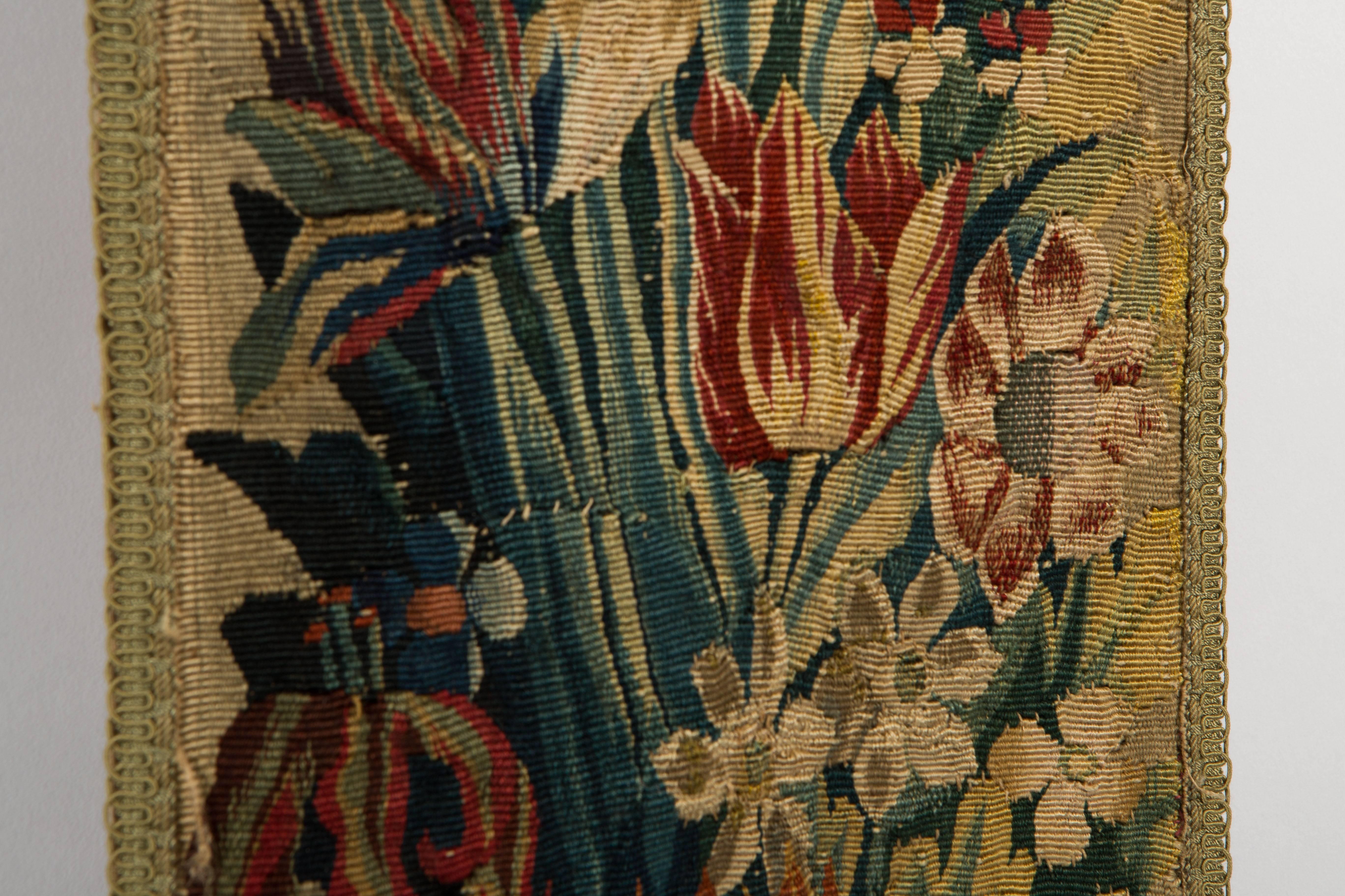 Late 17th century Flemish floral tapestry in blues and reds. The pattern consist of tulips and various other flowers. The design is very typical Flemish.