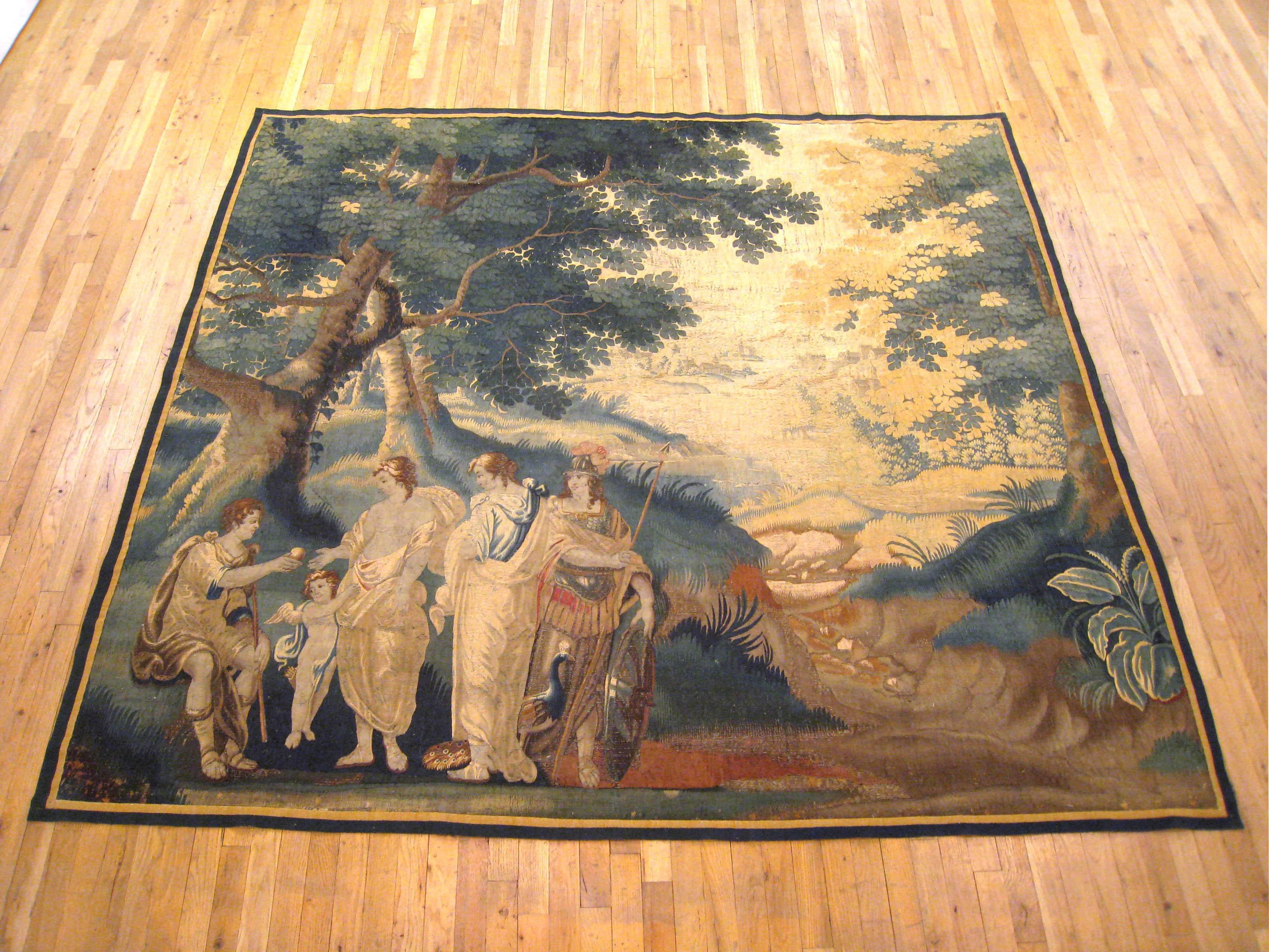 A French Aubusson mythological tapestry from the late 17th century, depicting the Judgment of Paris. In this famous scene, the handsome young man, Paris, seated at left, is chosen by the powerful deity, Zeus, to determine which of the three female