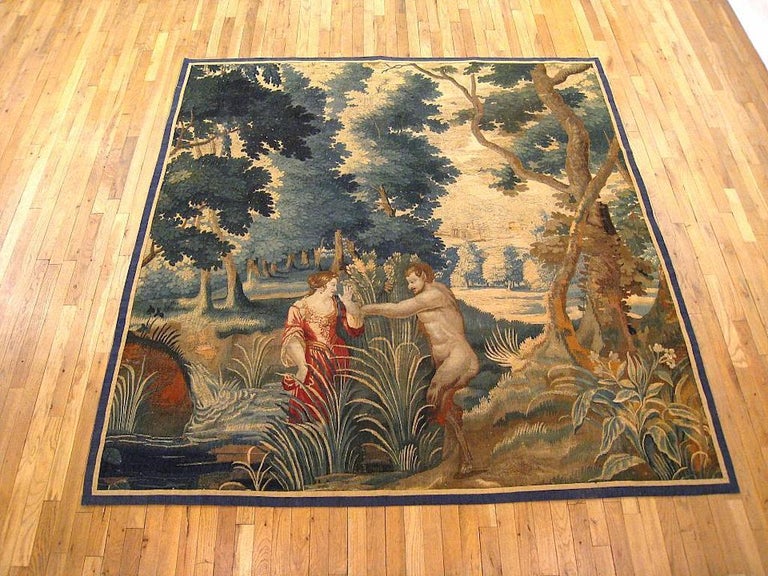 A French Aubusson mythological tapestry from the late 17th century. This tapestry describes the myth of Pan and Syrinx after Ovide’s Metamorphoses. The God Pan pursues the nymph of the Woods Syrinx. Keeping her Virtue, she runs until she reaches a