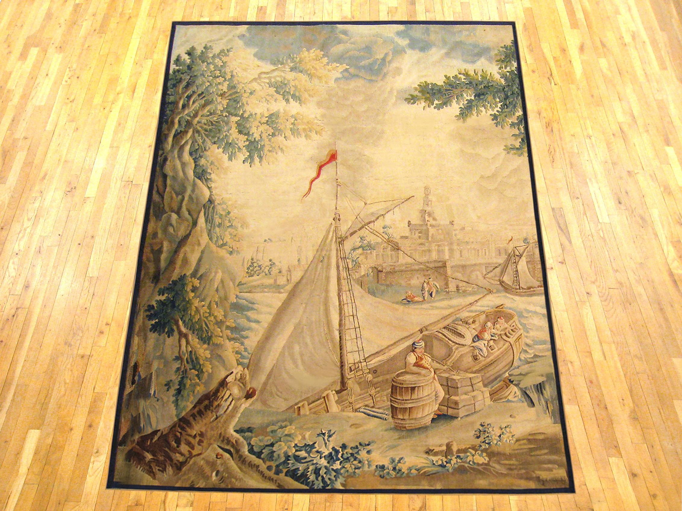 A French Aubusson rustic tapestry from the late 17th century, with the turbulent sea at center, and other ships docked by the riverside cityscape in the left distance. Enclosed by a narrow monochromatic border. Wool with silk inlay. Measures: 10’1”