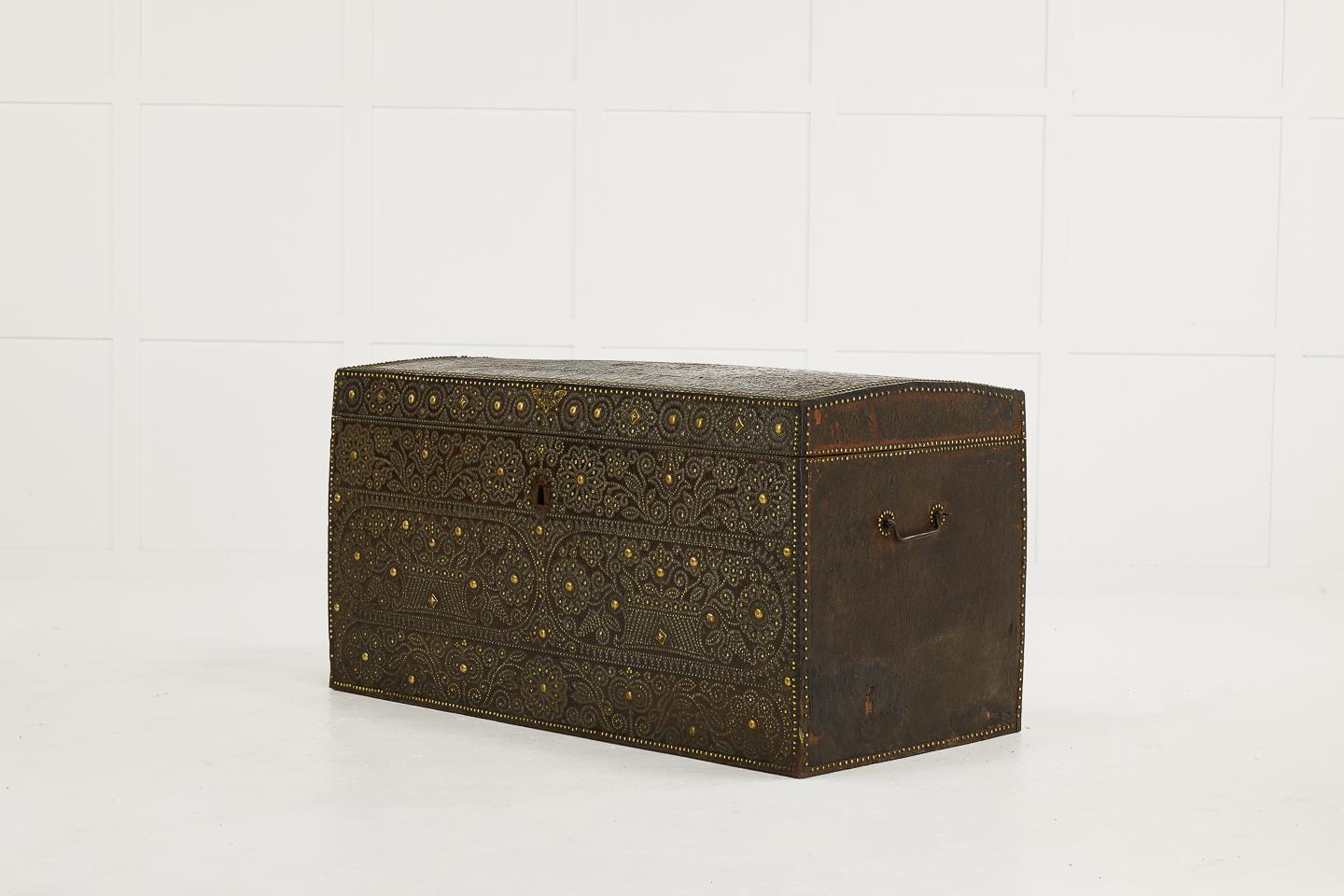 Late 17th-early 18th century French travelling trunk with brass stud decoration and wrought iron handles.