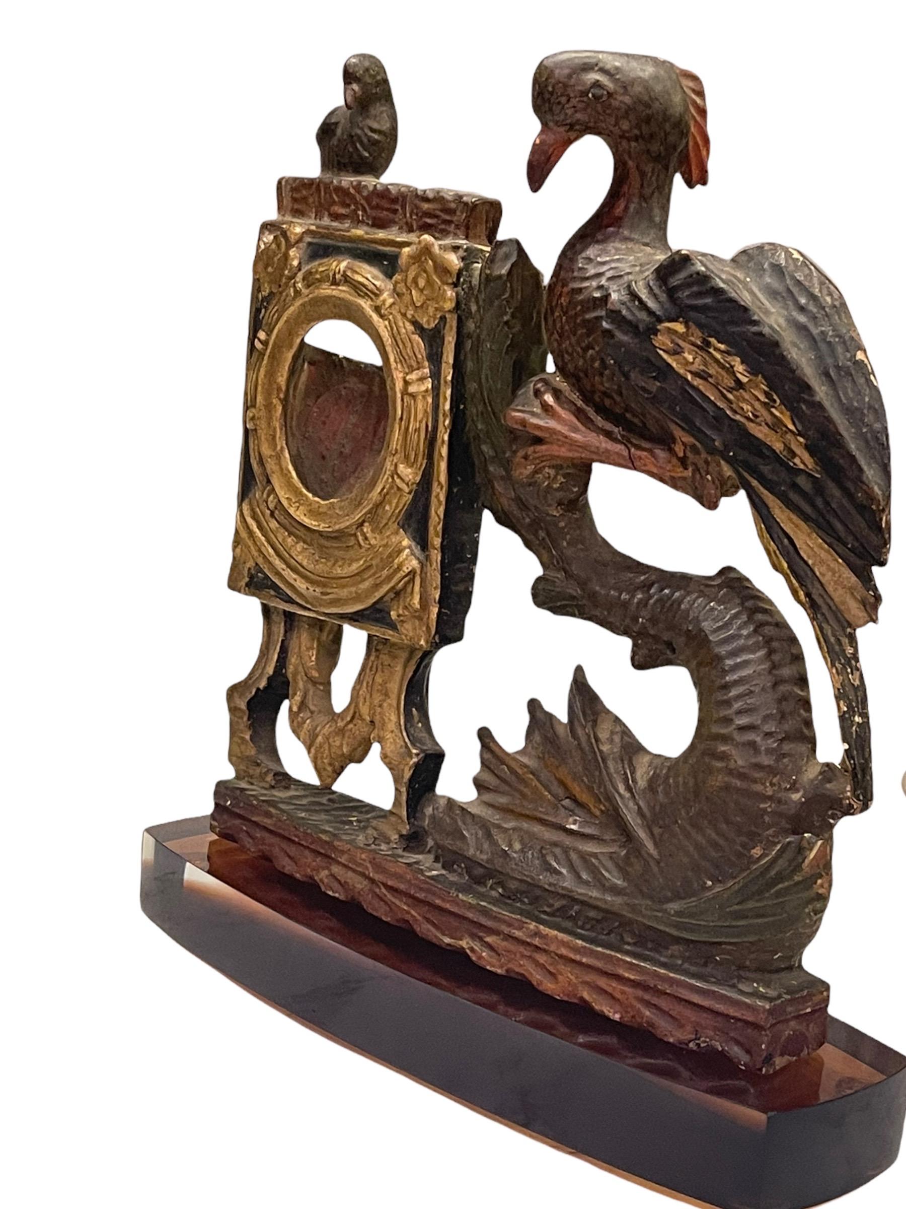 Late 17th century French extremely fine carved wood polychromed and gold gilded pocket watch holder. It has a carved cup behind the front opening to hold the pocket watch. These became a very decorative ornament for the mantlepieces for aristocrats