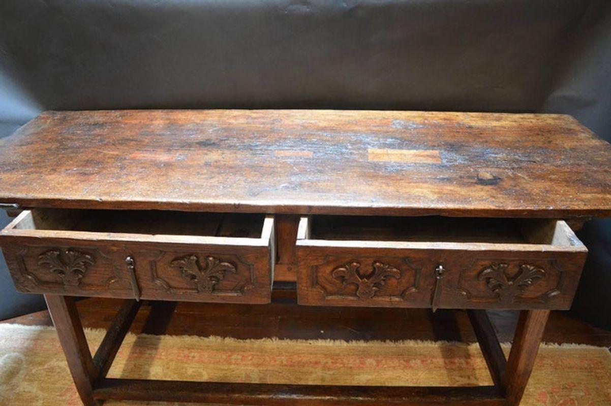Late 17th century Italian, hand-carved table with drawers.