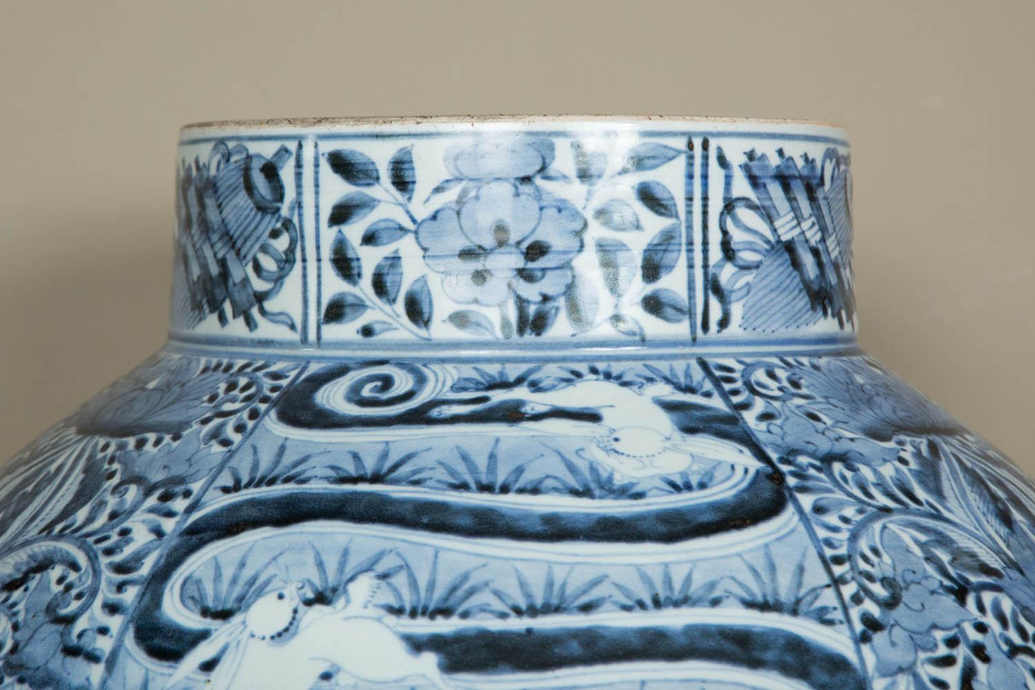 A large blue and white Japanese Arita porcelain vase featuring an interesting decoration of phoenixes and strolling branches of peonies and chrysanthemums among rocks and little hares wearing an unusual necklace. Very fine decoration.
Dating, circa