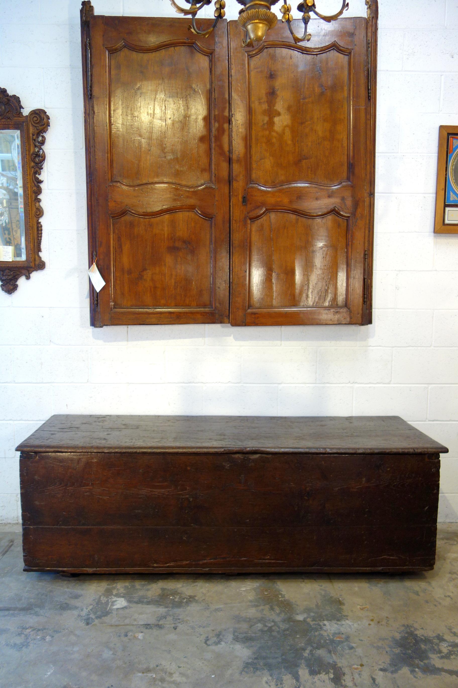 Stately and large, this antique 17th Century Italian bridal trunk was handcrafted of Italian native oak (Quercus frainetto) with hand-forged hardware. Rich, dark, well-preserved patina illustrates generations of fine aging and utility. Solid and