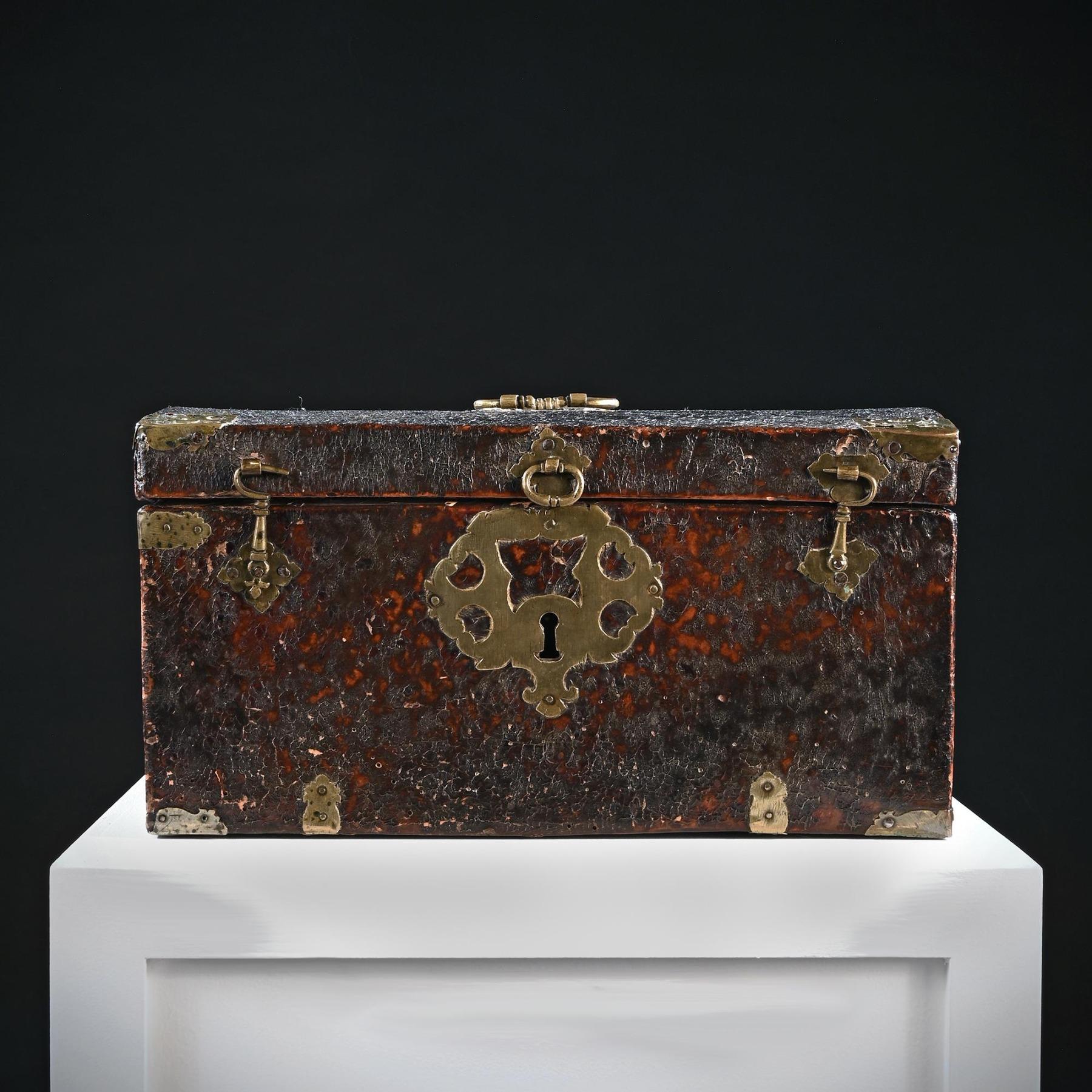 A very fine and interesting late 17th century English work box or travelling case

English Circa 1680

Of conventional form with slightly domed lid, this piece has acquired a magnificent patina and colour-the leather showing all the wear one would