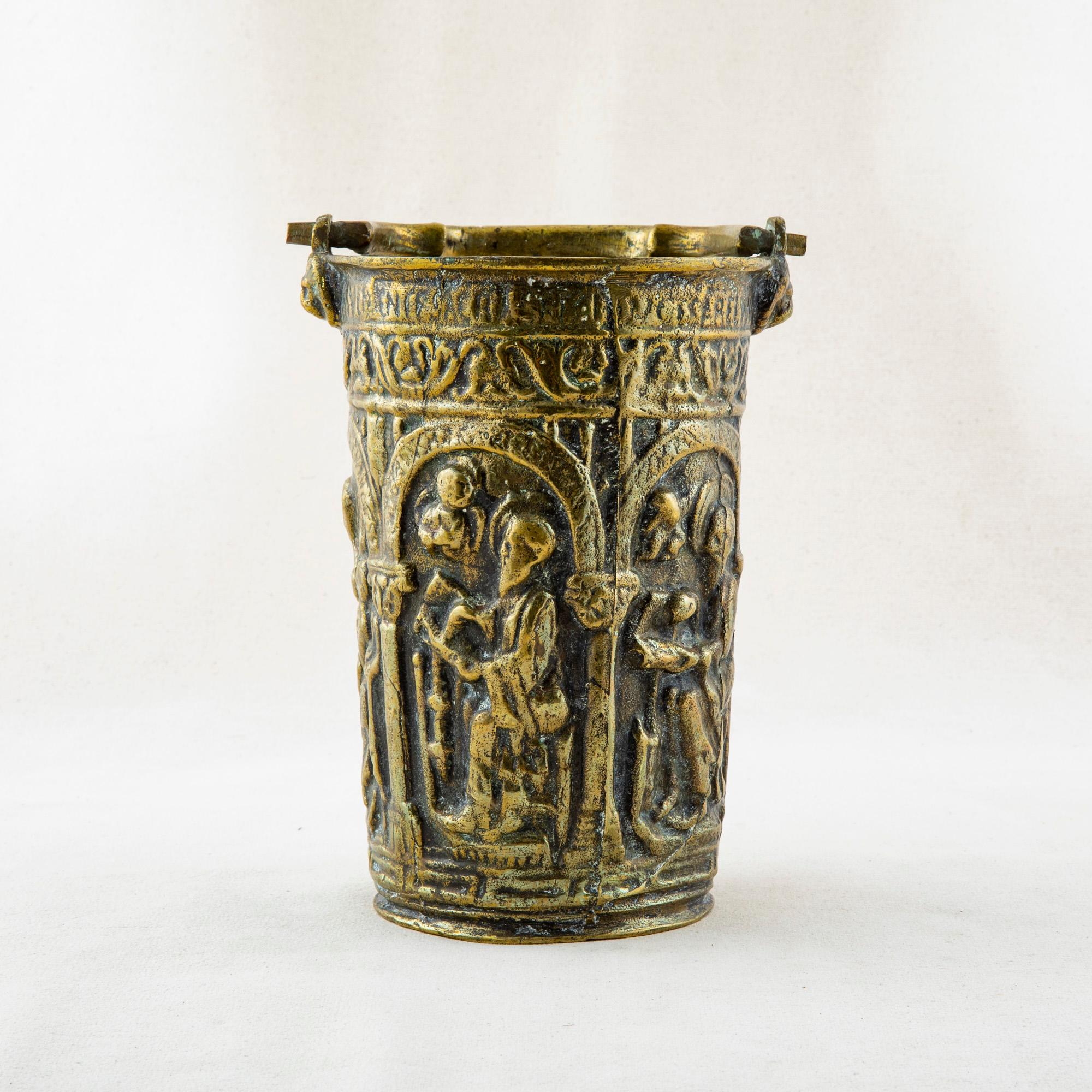 Used by a priest to bless the congregation, this late seventeenth century Louis XIV period bronze holy water vessel features a Gothic scene depicting monks attending to their monastic duties. A unique historical artifact for collectors, this piece