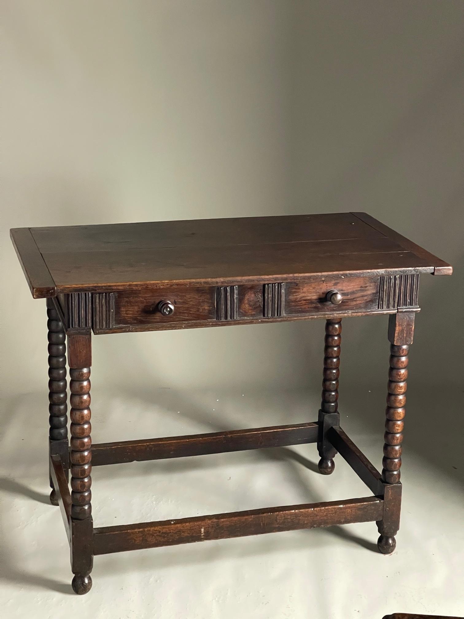 Late 17th Century Oak Side Table with Drawer, nice well turned legs and original wood nobs. Good 2 plank cleated top.

size 98 cms long 56 deep 78 high