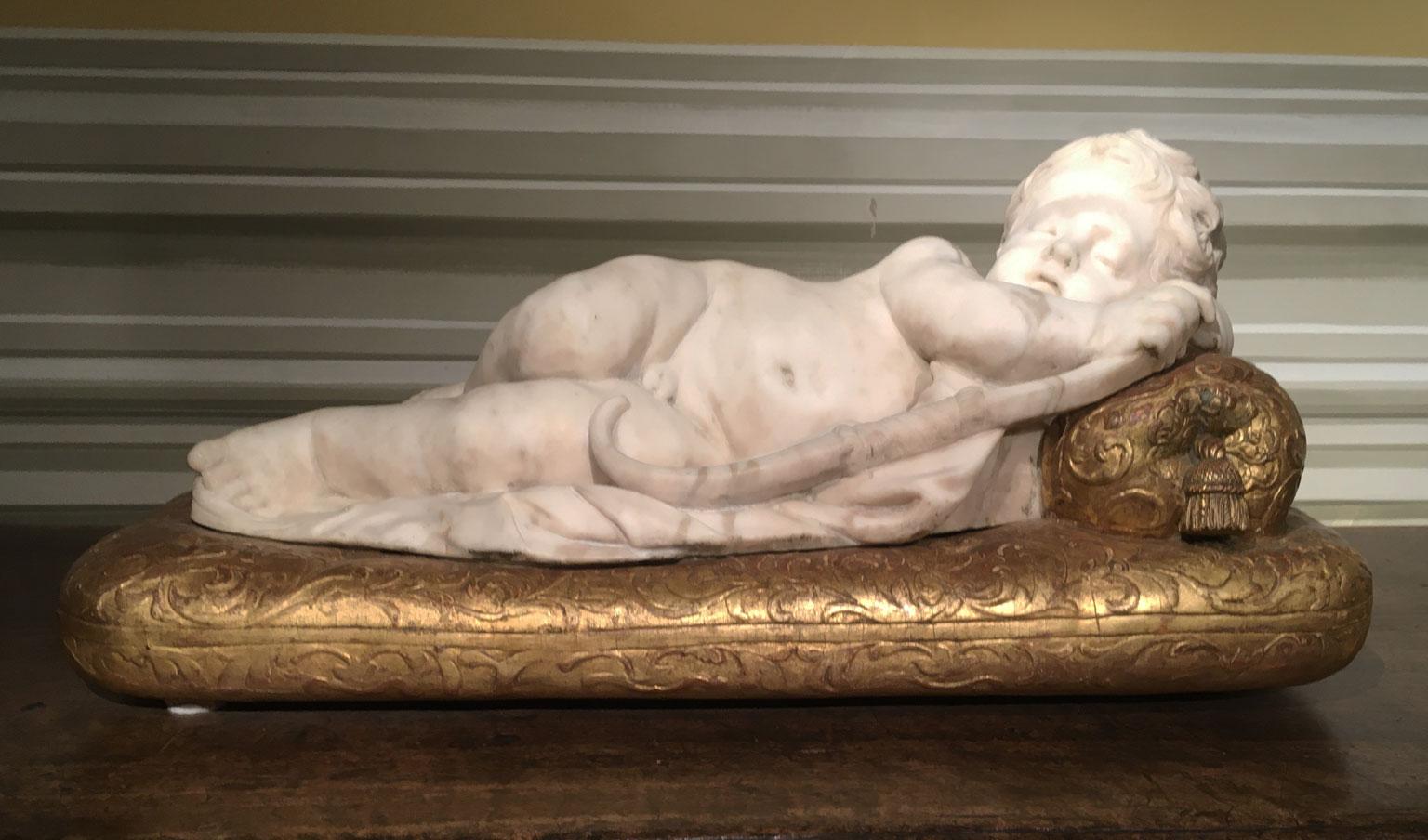 Italian Late 17th Century White Marble Carved Child Nude Cupid Sculpture on Gilded Base For Sale