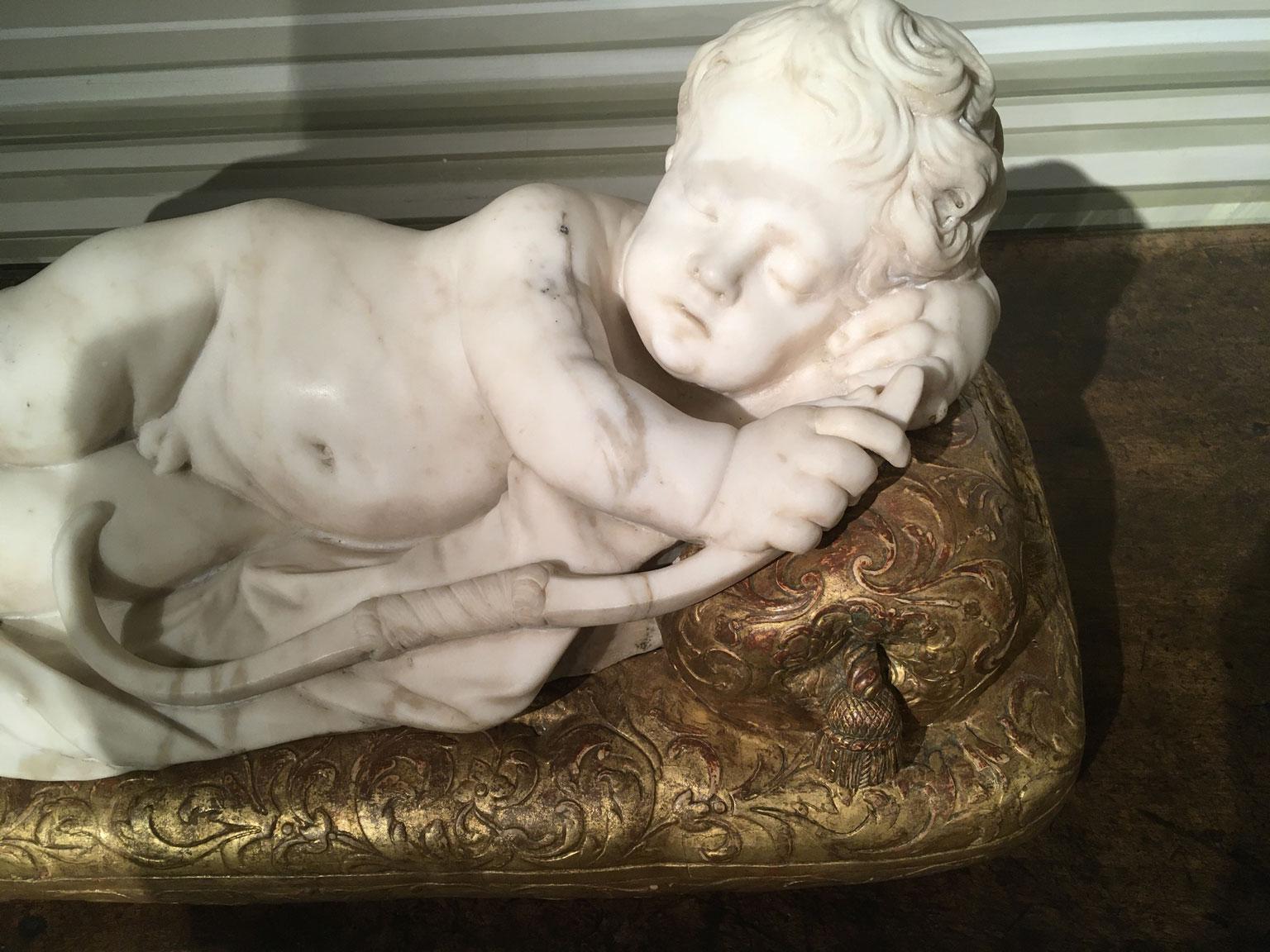 Hand-Carved Late 17th Century White Marble Carved Child Nude Cupid Sculpture on Gilded Base For Sale