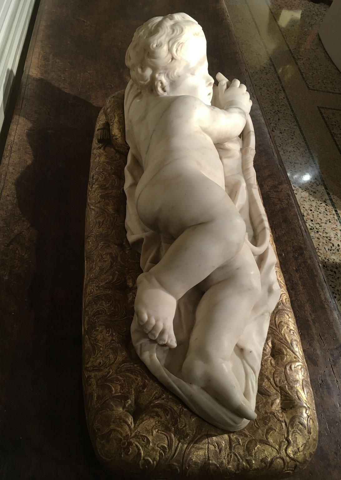 Late 17th Century White Marble Carved Child Nude Cupid Sculpture on Gilded Base For Sale 3