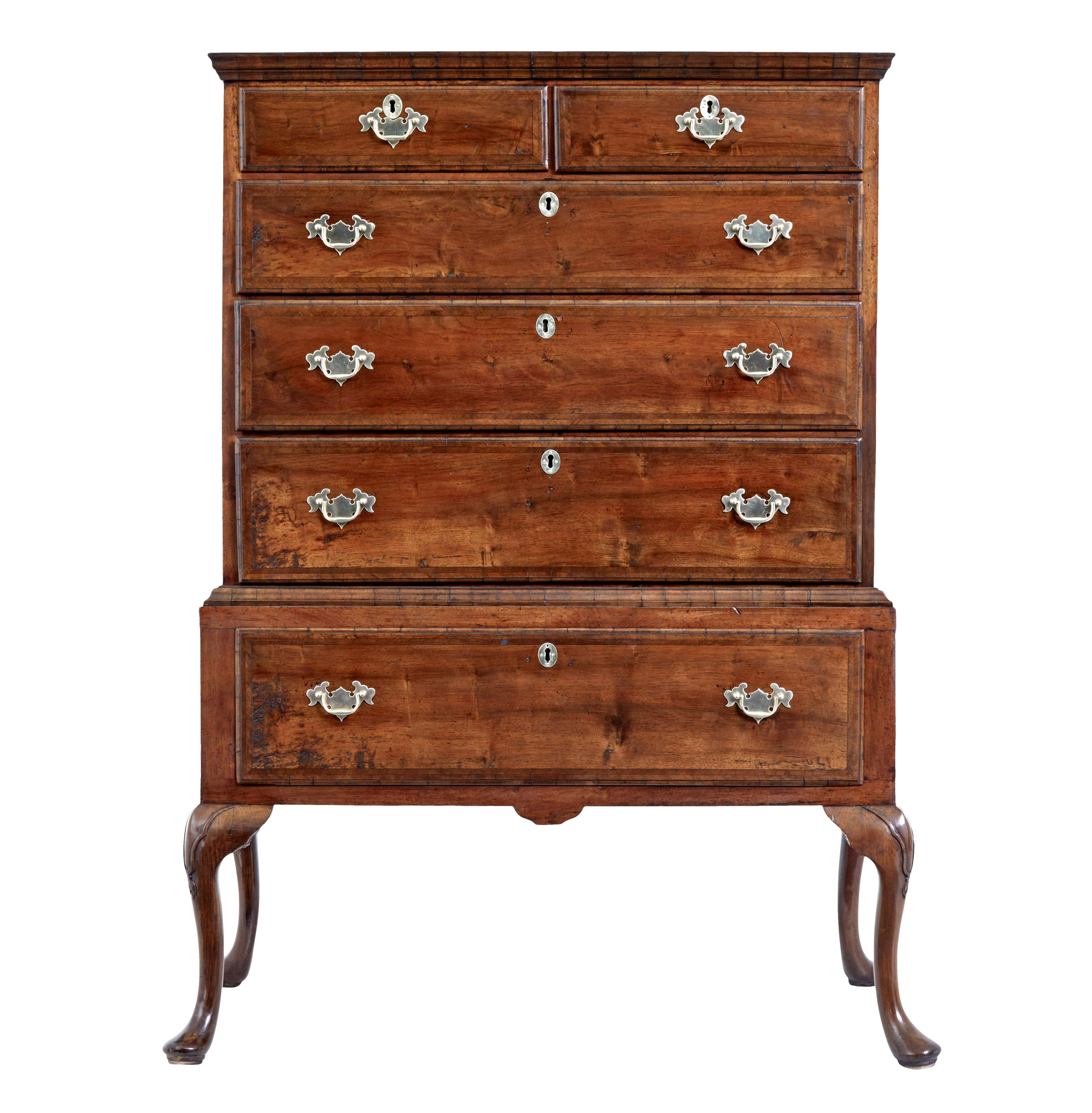 Late 17th century William and Mary walnut chest on stand circa 1690.

Good quality 2 piece William and Mary period chest on original base.

Shaped cornice to the top surface with a 2 over 3 drawer layout below.  Each drawer cross banded with