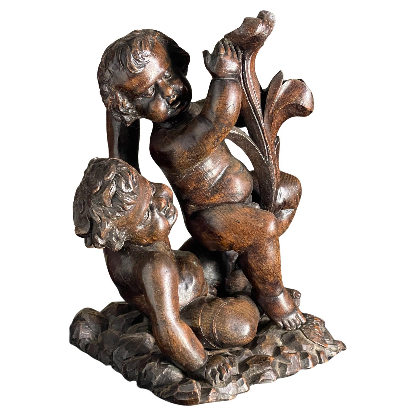 Late 17th century wood carving of Putto For Sale