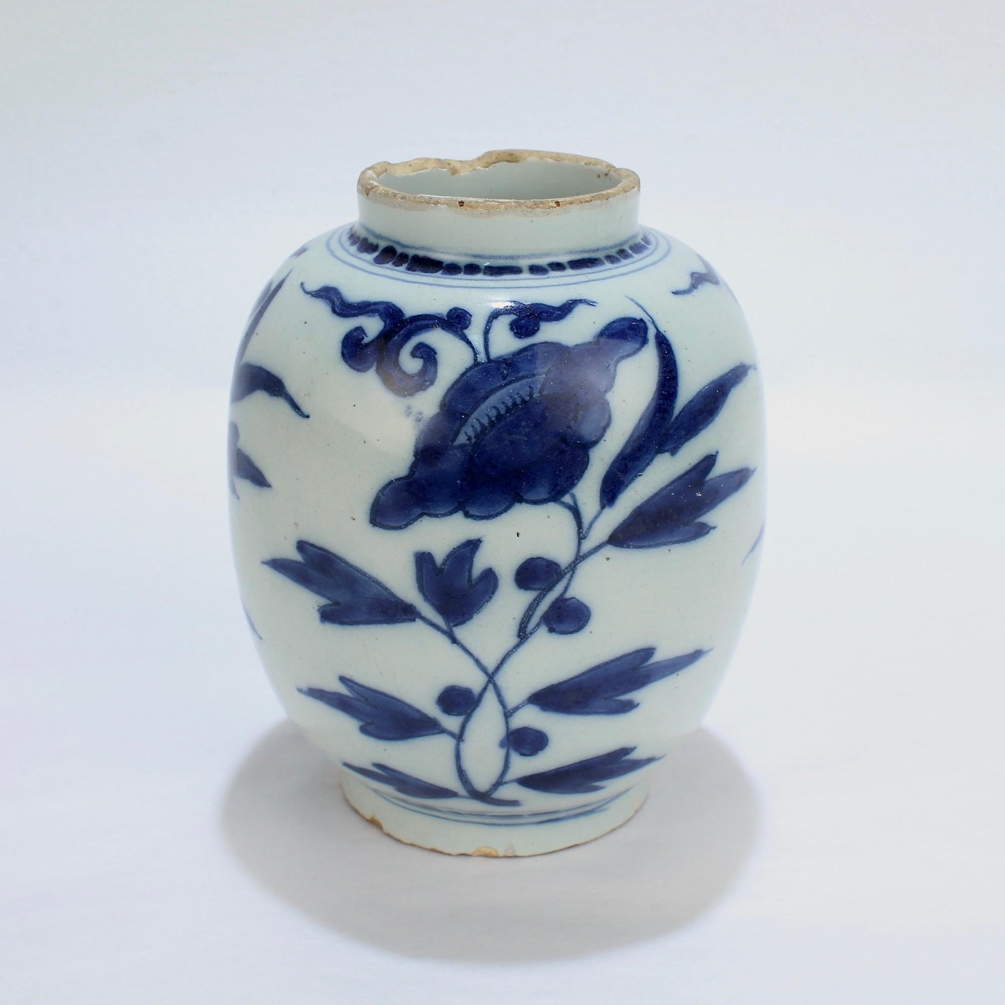 A fine, diminutive, and early Dutch Delft pottery vase or jar marked for Gerrit Kam.

With a stylized Chinese peony flower pattern.

Bearing an underglaze blue GK monogram to the base for Gerrit Kam.

During his lifetime, Kam was active both in the