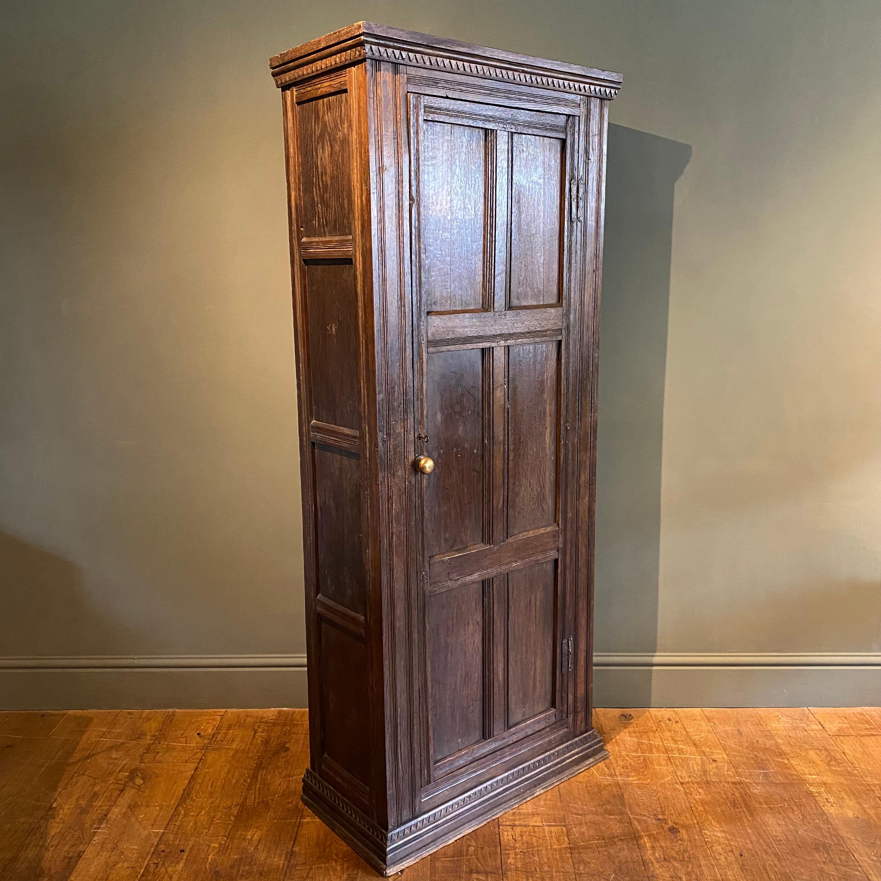 A very useful early English oak cupboard. The slender size means it would be perfect for a halfway or small flat. It was once used as a gun cabinet so still has internal bolts which could easily be removed. Quite possibly started off life as a