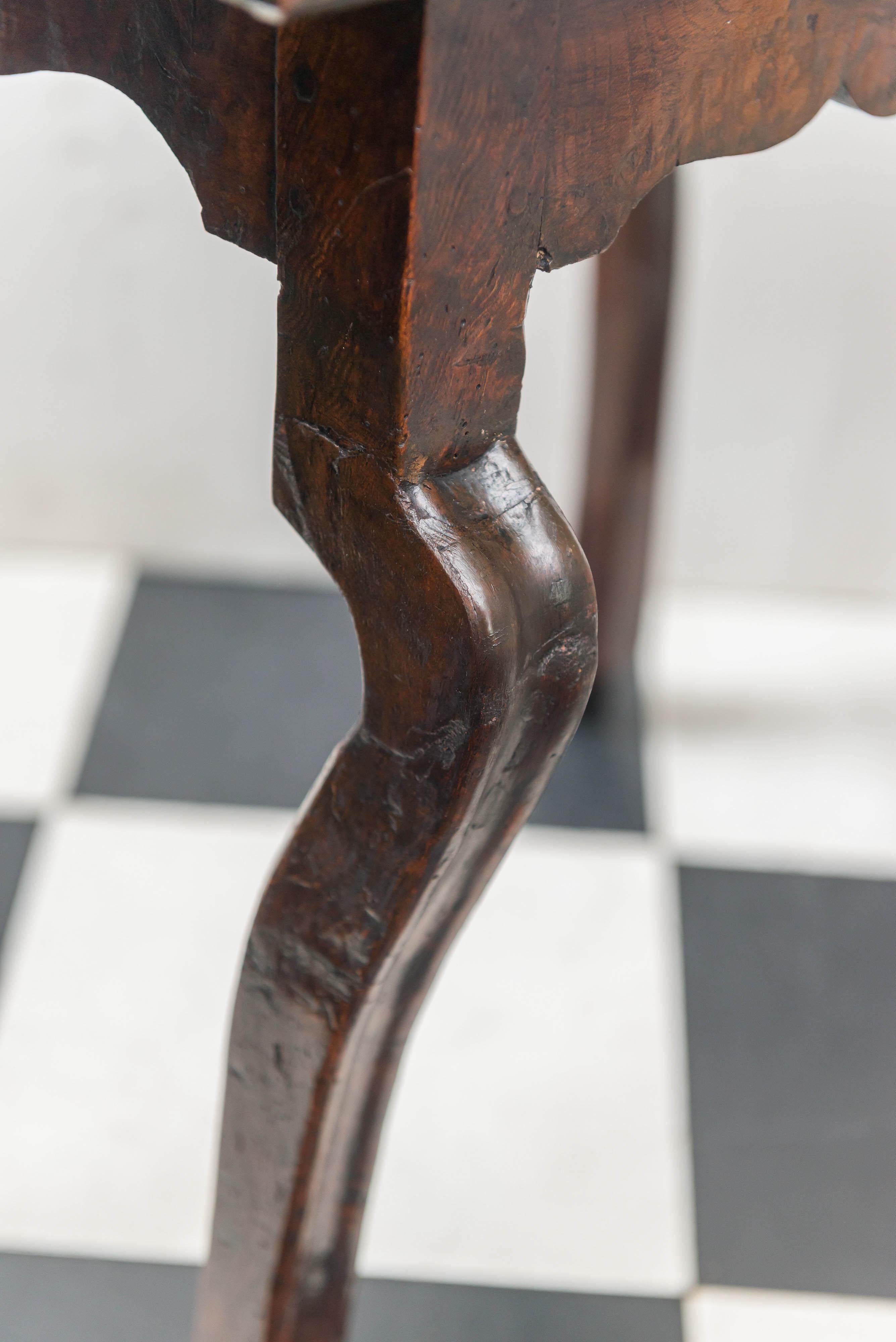 Late 17th-early 18th century, Italian burl walnut top side table. Unusual out curved cabriole type legs. Solid Burl wood matched two board top. Bold end-grained coved and beaded gallery top. Finely shaped aprons under the top. The out curved legs