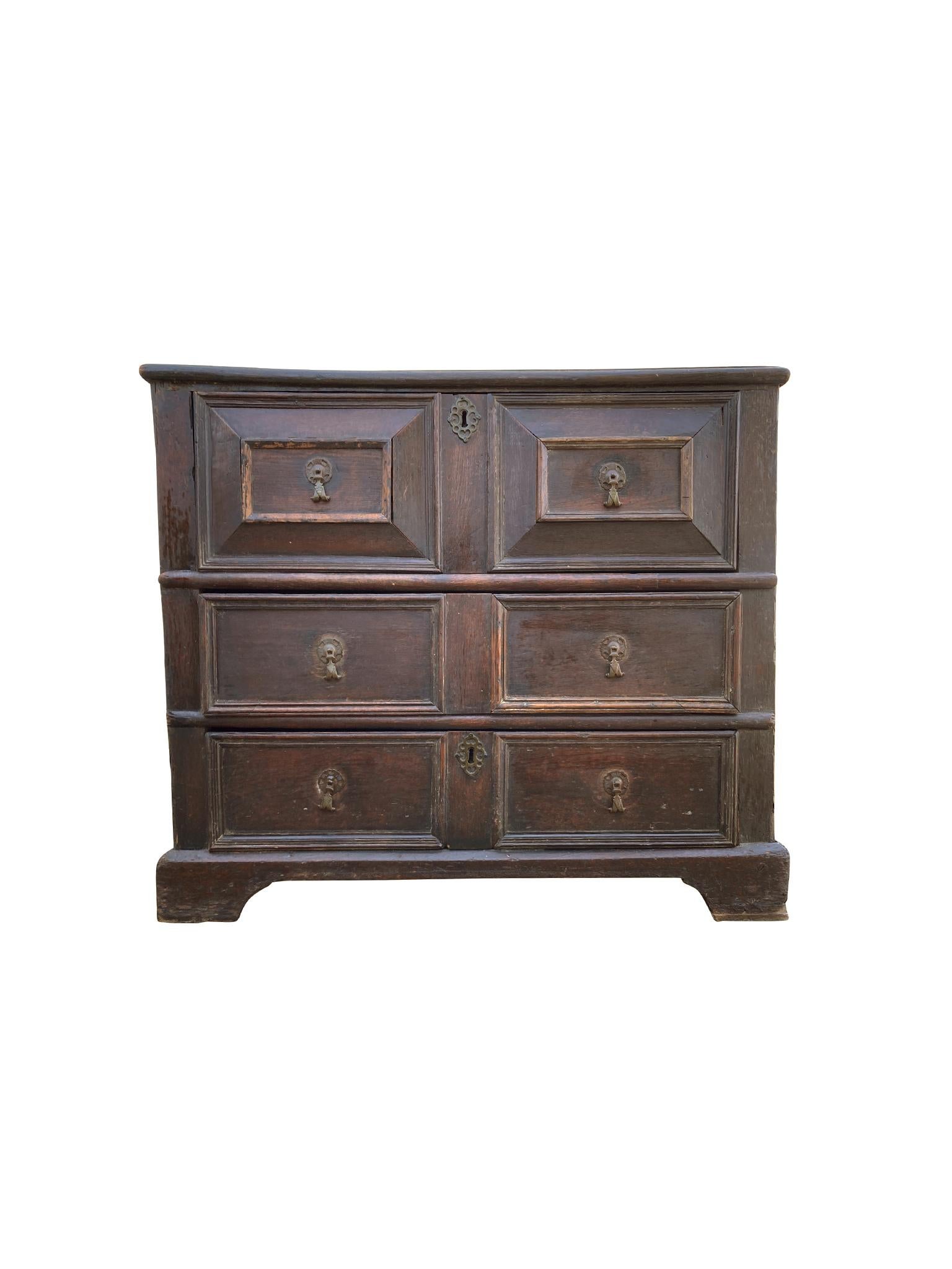 Beautifully aged William & Mary chest of drawers, hand-crafted Late 17th-Early 18th Century. The chest is oak with metal pulls. We love the warm tone of the wood and the organic wear it has accrued over the centuries. The design of the chest