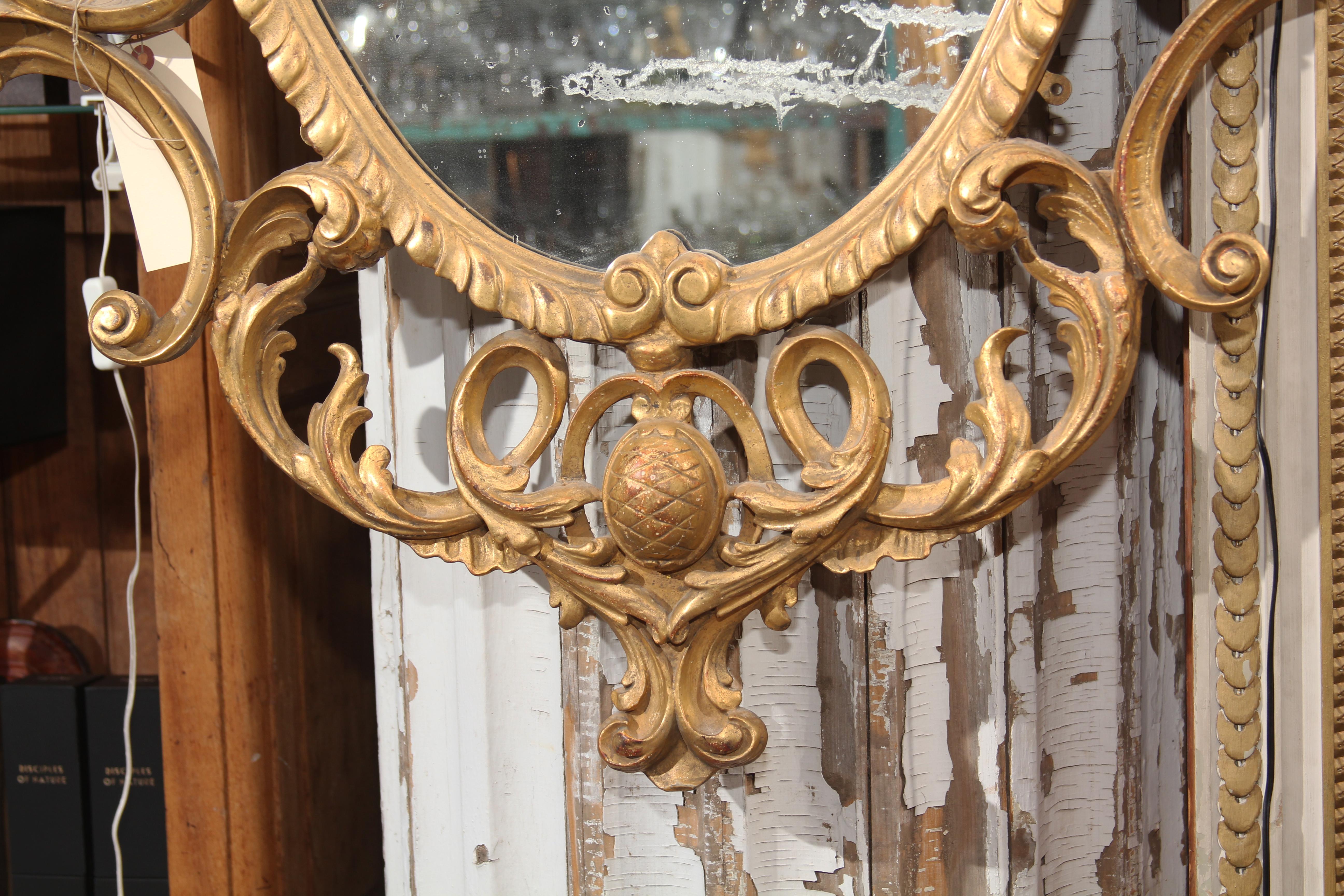 ornate carved wood mirror