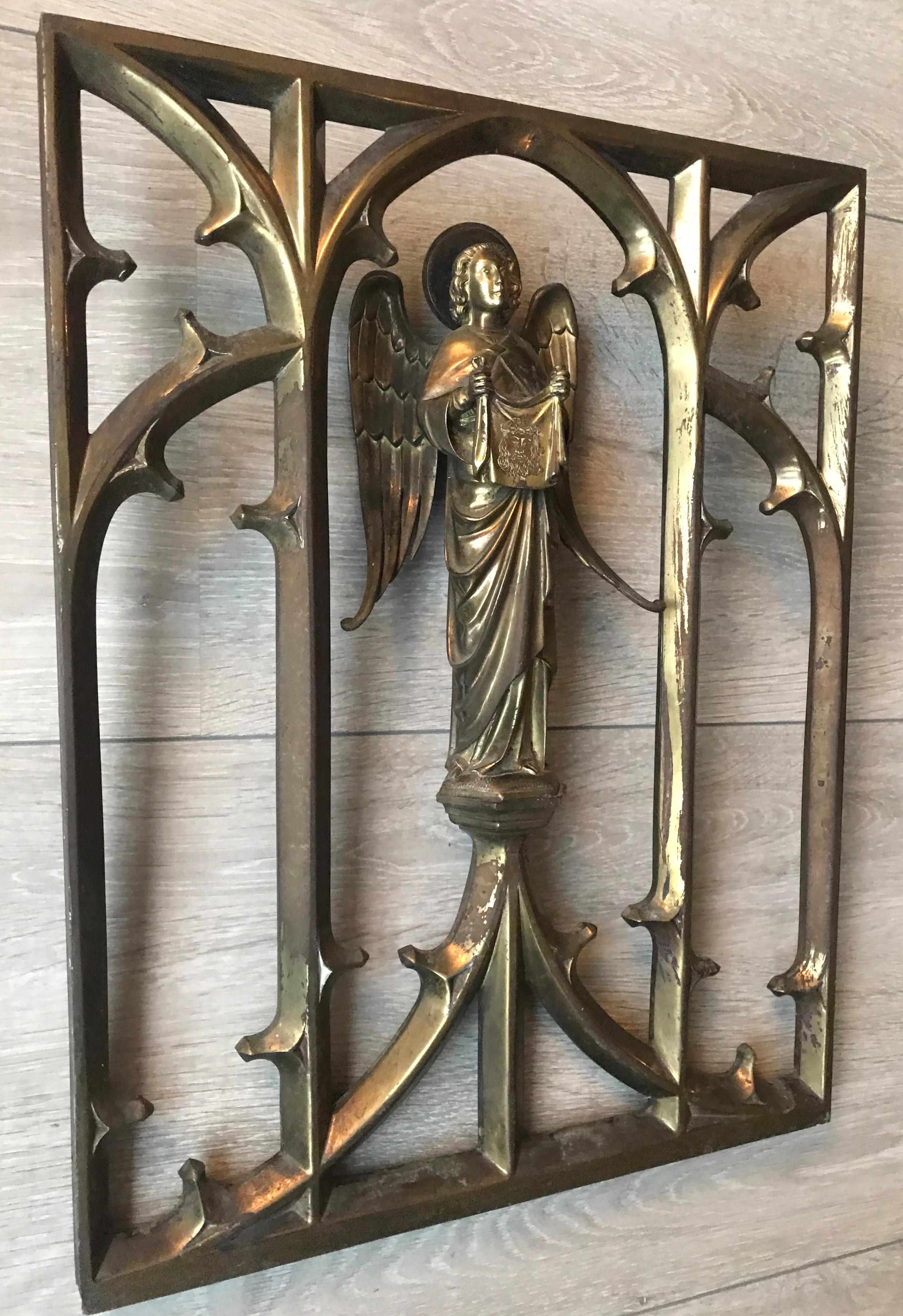 Heavy bronze Gothic church window frame with a Saint Veronica sculpture.

This incredibly well made and strong, bronze window frame with a sizable angel statue in the center is another one of our recent great finds. This rare and highly decorative